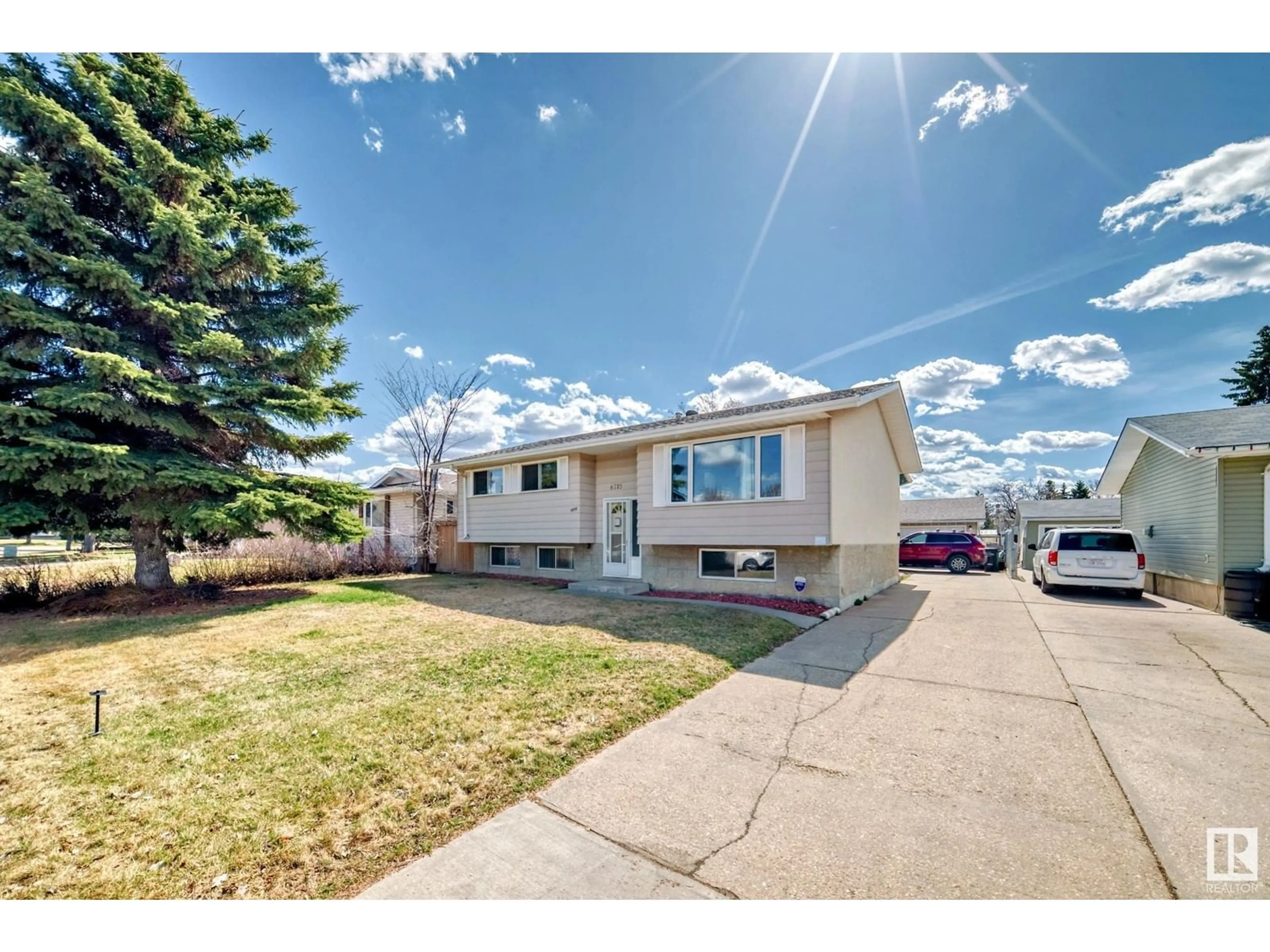 Home with vinyl exterior material, street for 6715 32 AV, Edmonton Alberta T6K1L8