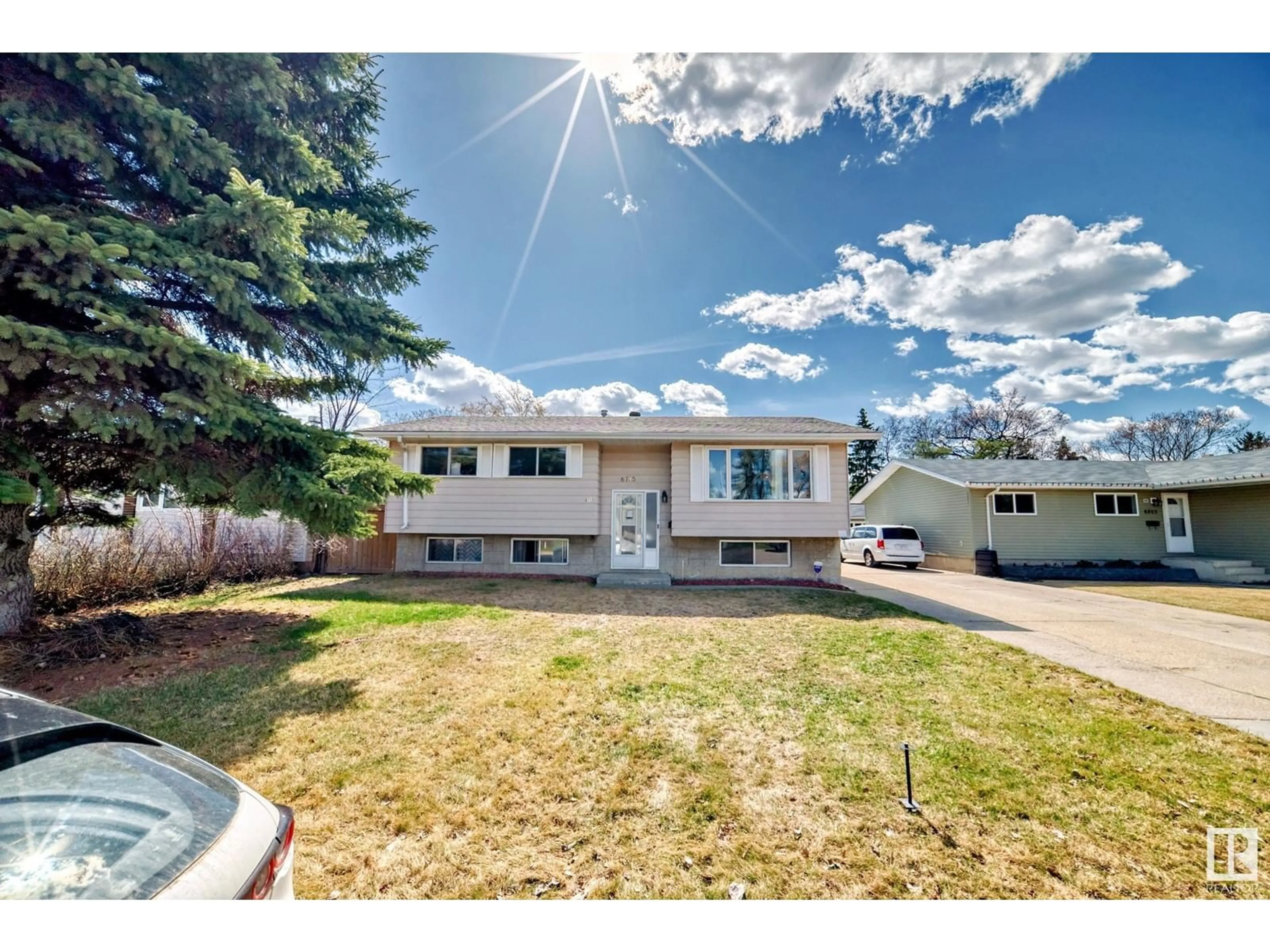 Home with vinyl exterior material, street for 6715 32 AV, Edmonton Alberta T6K1L8