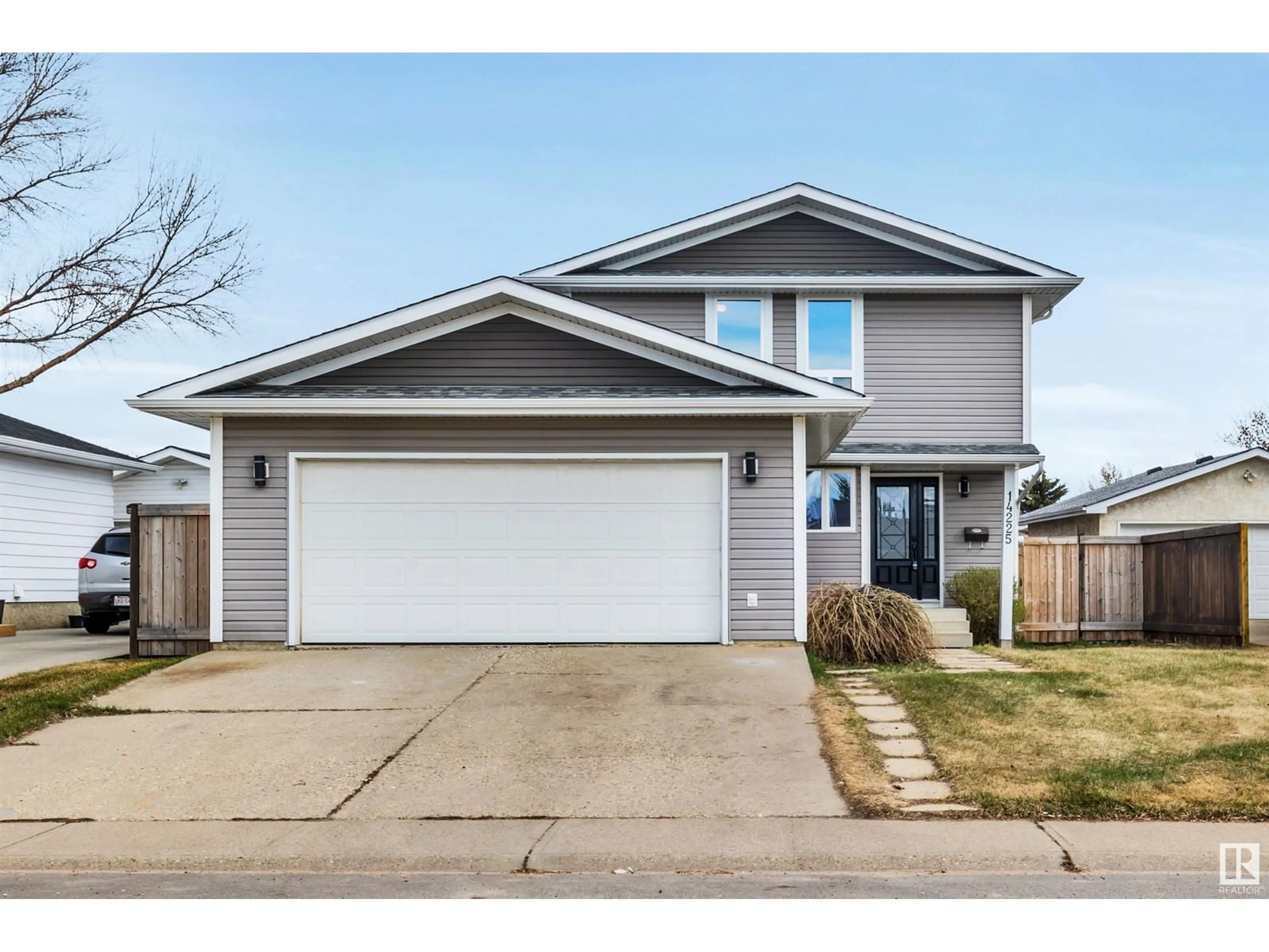 Home with vinyl exterior material, street for 14225 24A ST NW, Edmonton Alberta T5Y1N7