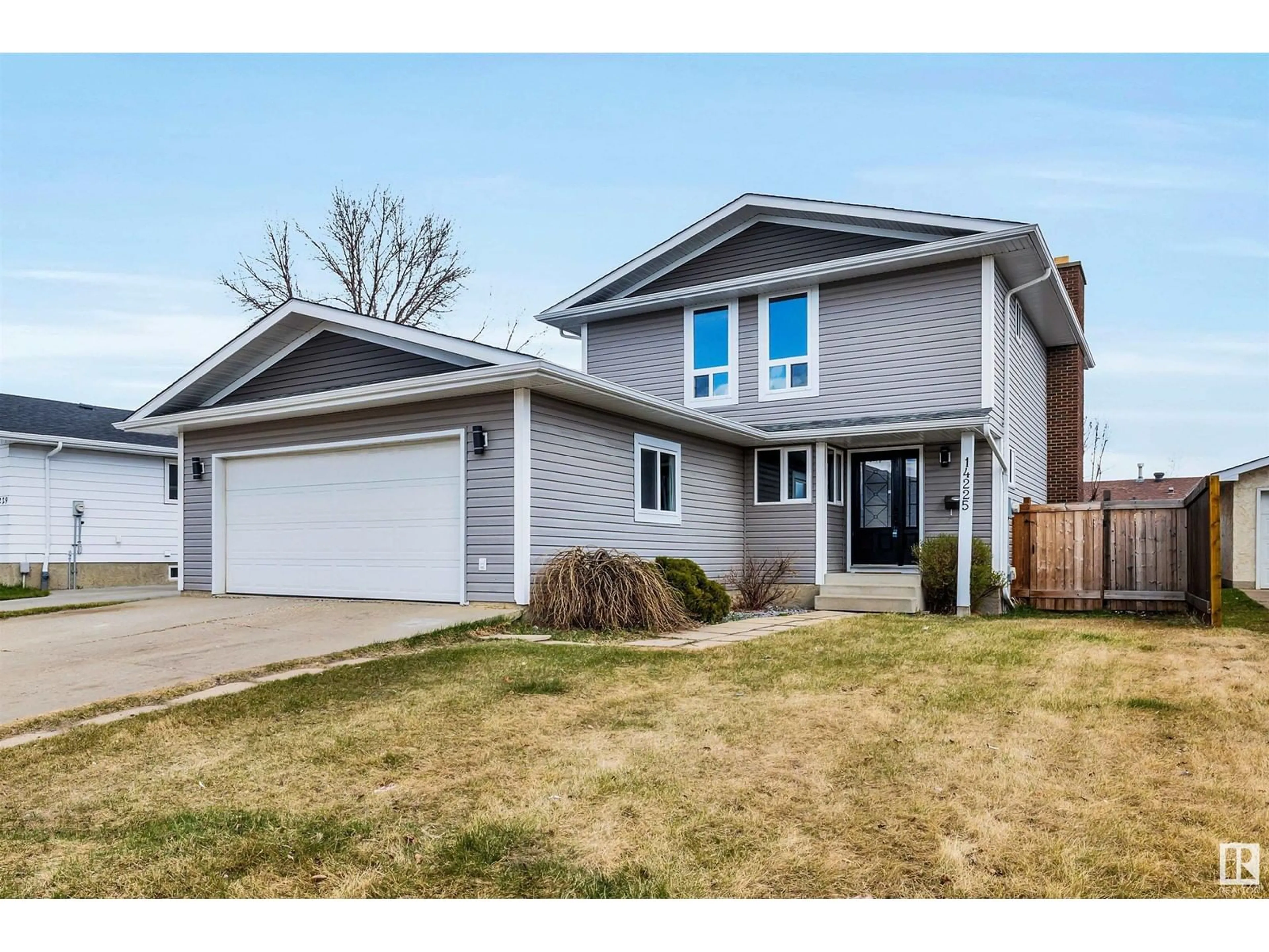 Home with vinyl exterior material, street for 14225 24A ST NW, Edmonton Alberta T5Y1N7