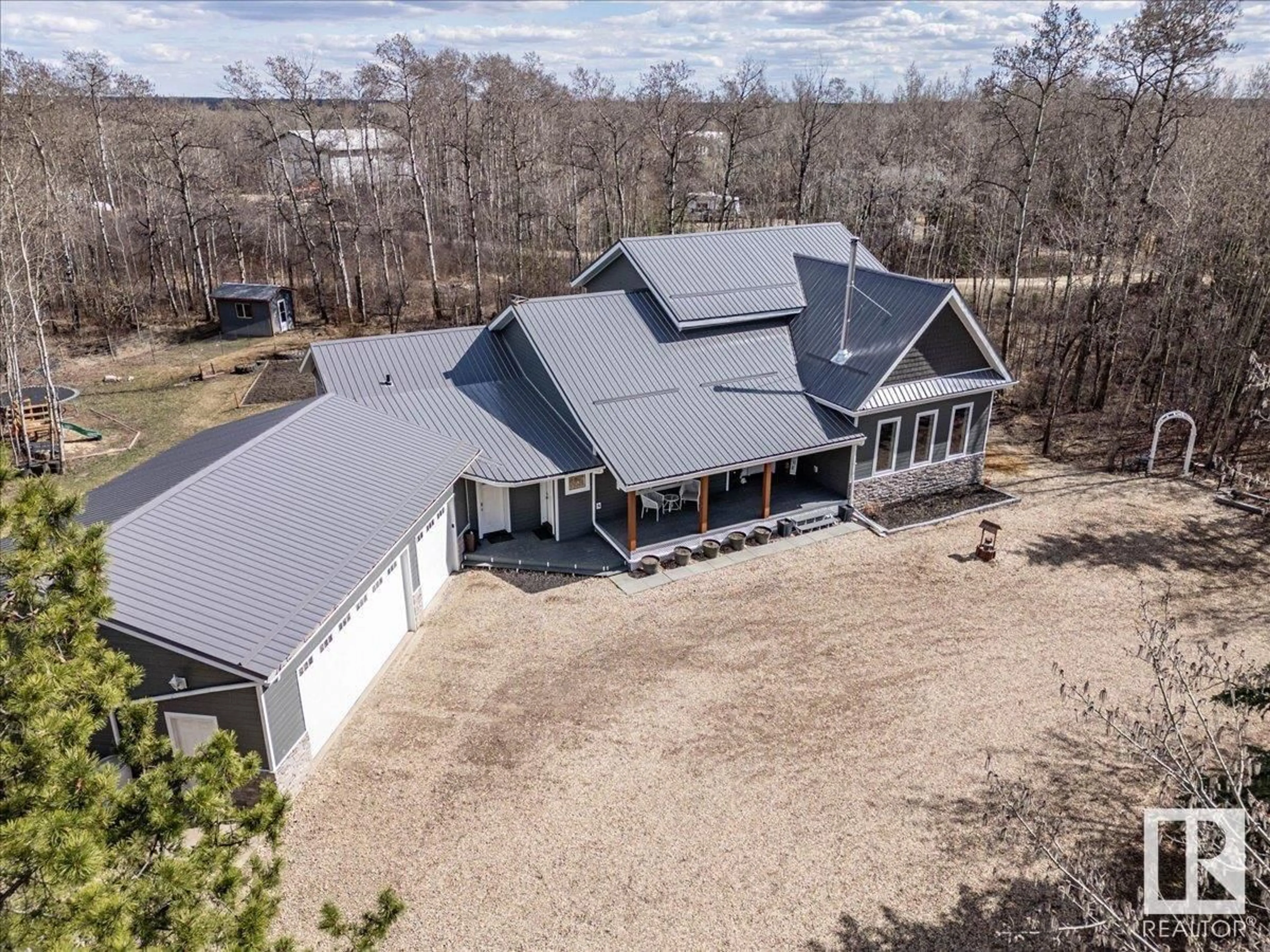A pic from outside/outdoor area/front of a property/back of a property/a pic from drone, unknown for 90 23016 TWP ROAD 504, Rural Leduc County Alberta T0B3M1