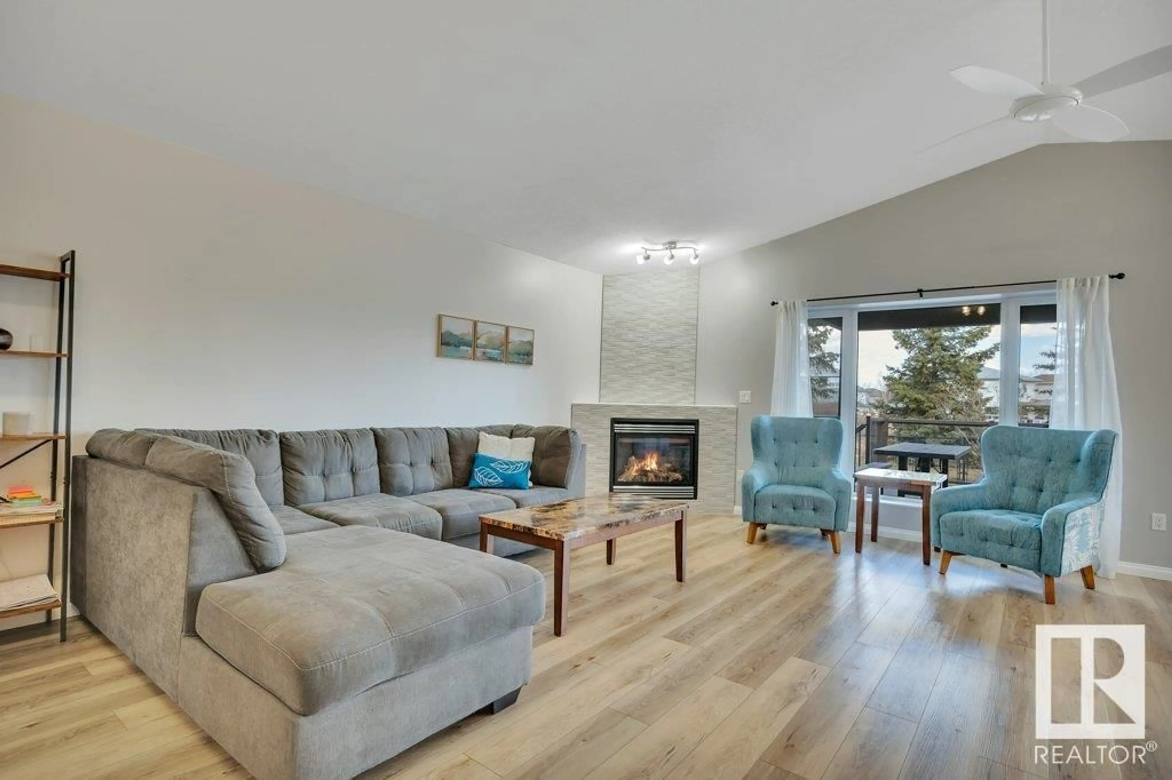 Living room with furniture, wood/laminate floor for 78 WILKINSON PL, Leduc Alberta T9E8N3