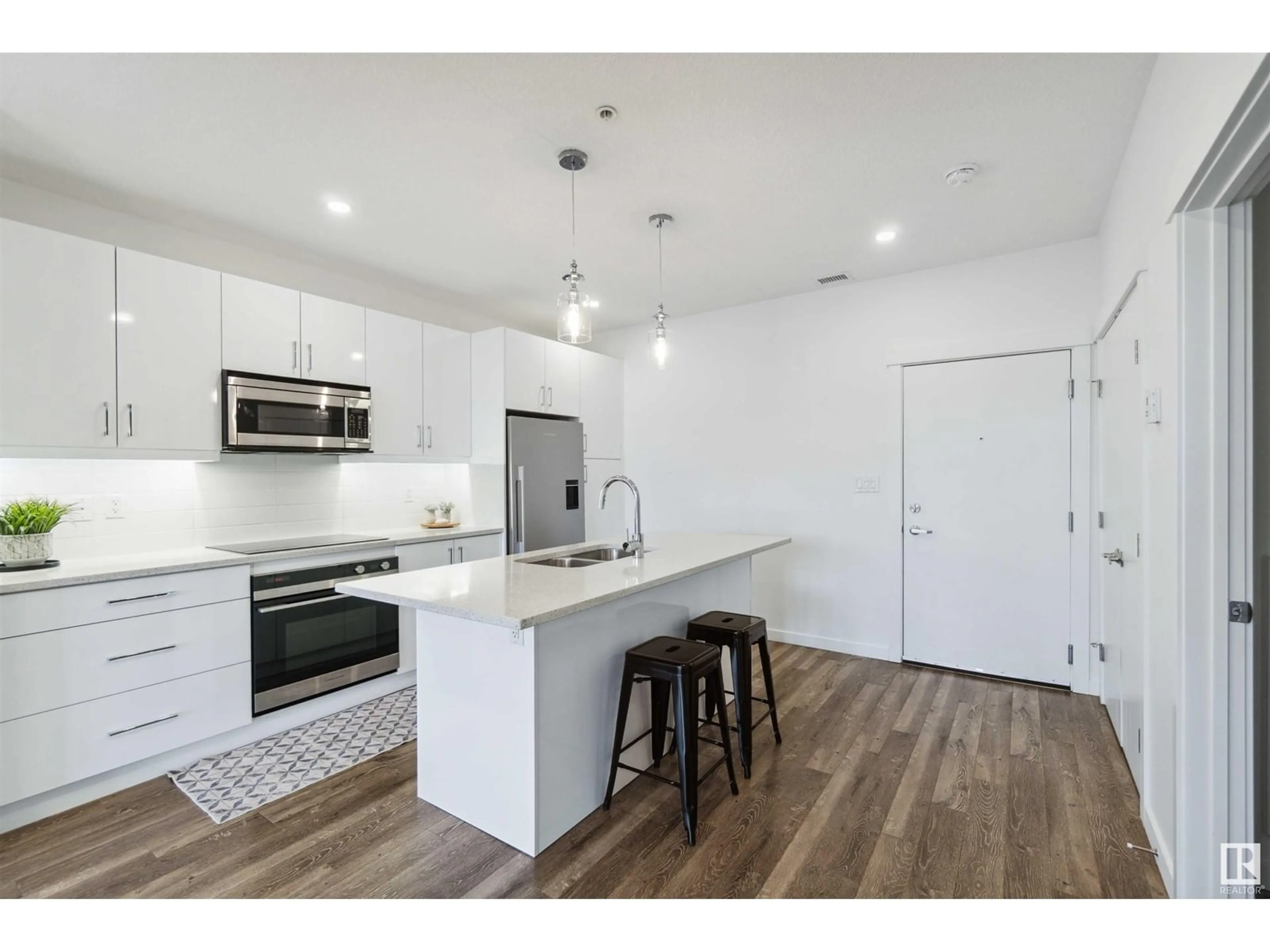 Open concept kitchen, wood/laminate floor for 418 11503 76 AV NW, Edmonton Alberta T6G0K6
