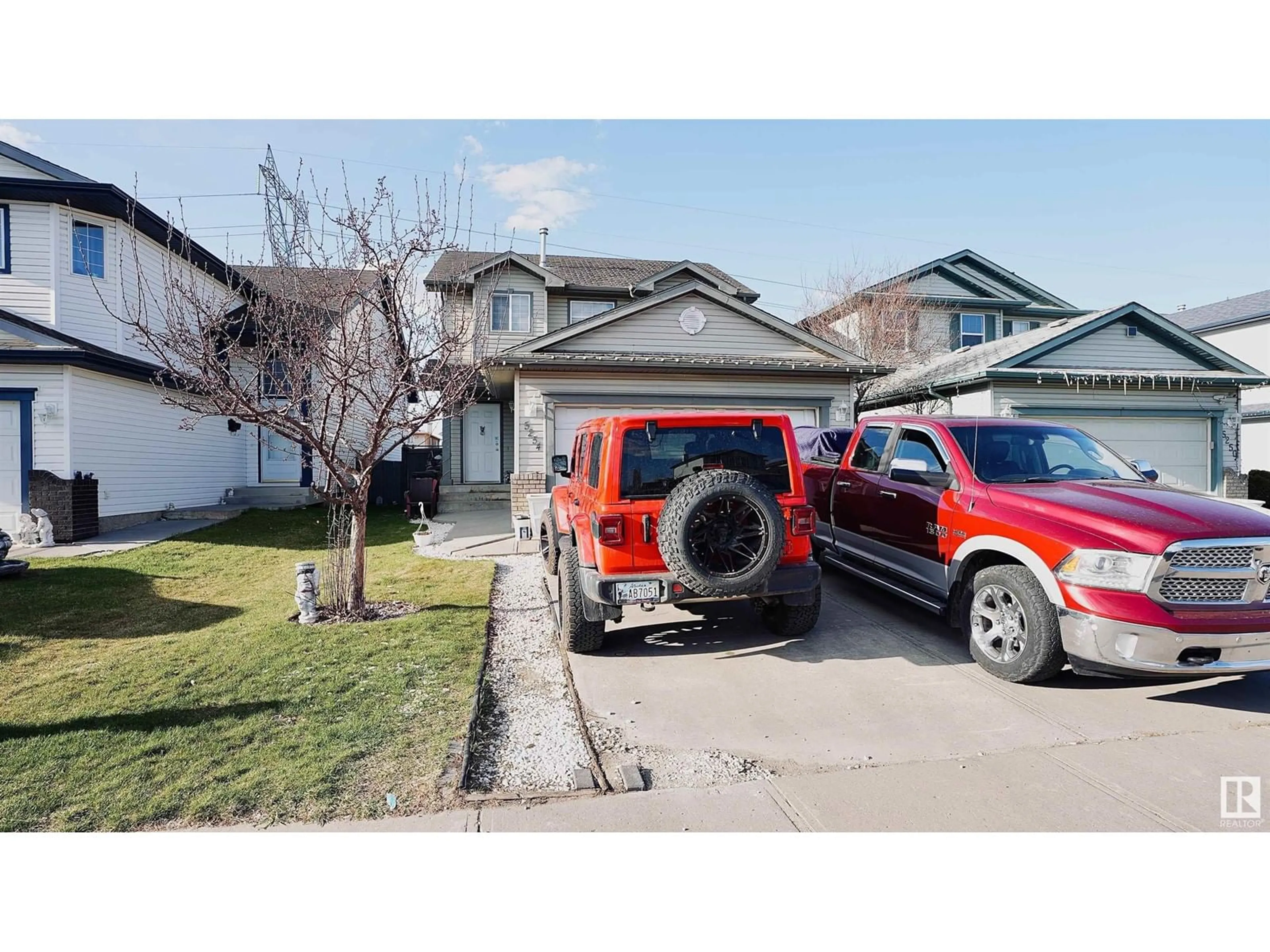 Home with vinyl exterior material, street for NW - 5254 162A AV, Edmonton Alberta T5Y3C7