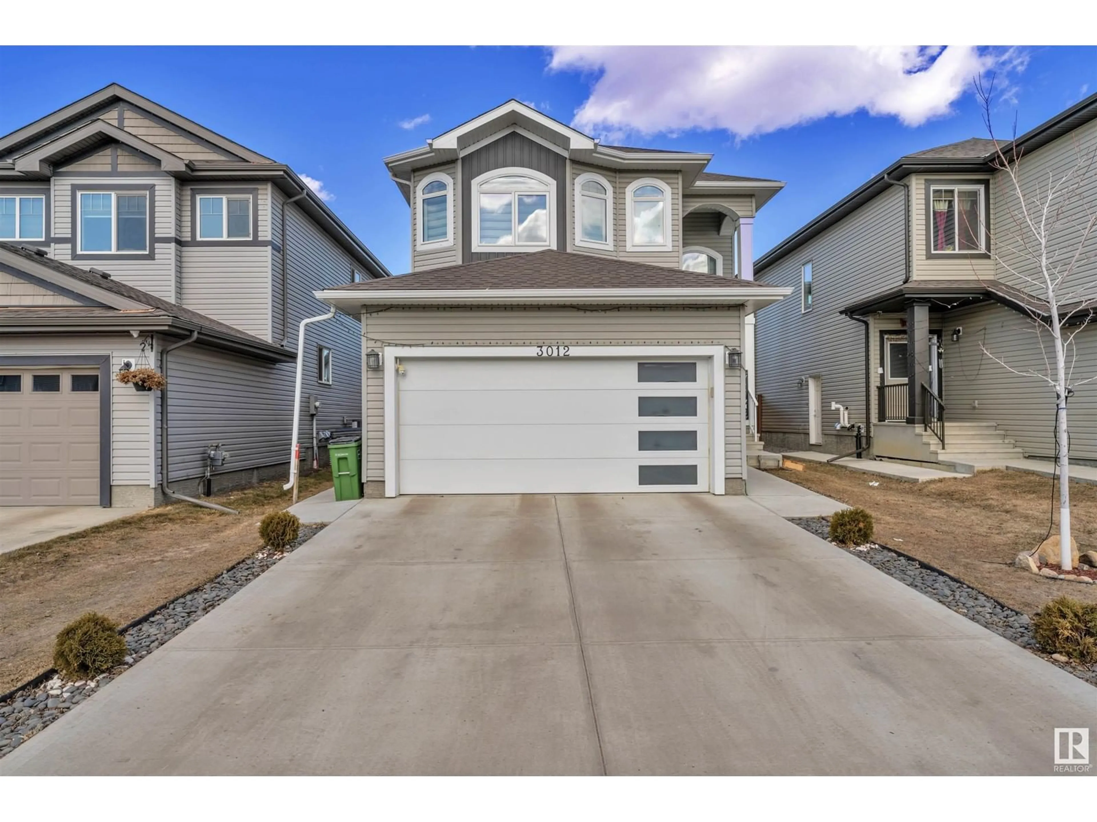 Home with vinyl exterior material, street for NW - 3012 12 AV, Edmonton Alberta T6T2H1