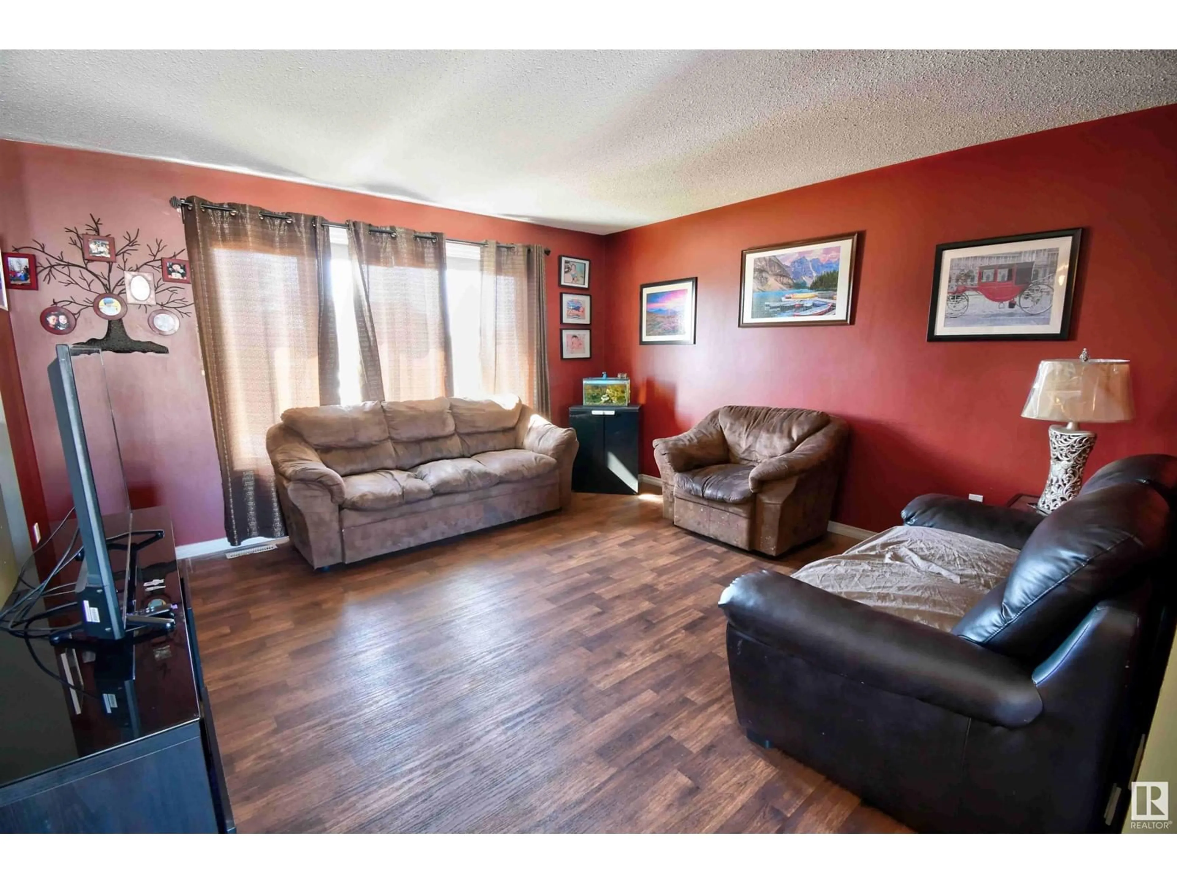 Living room with furniture, wood/laminate floor for 4014A 45 AV, St. Paul Town Alberta T0A3A2