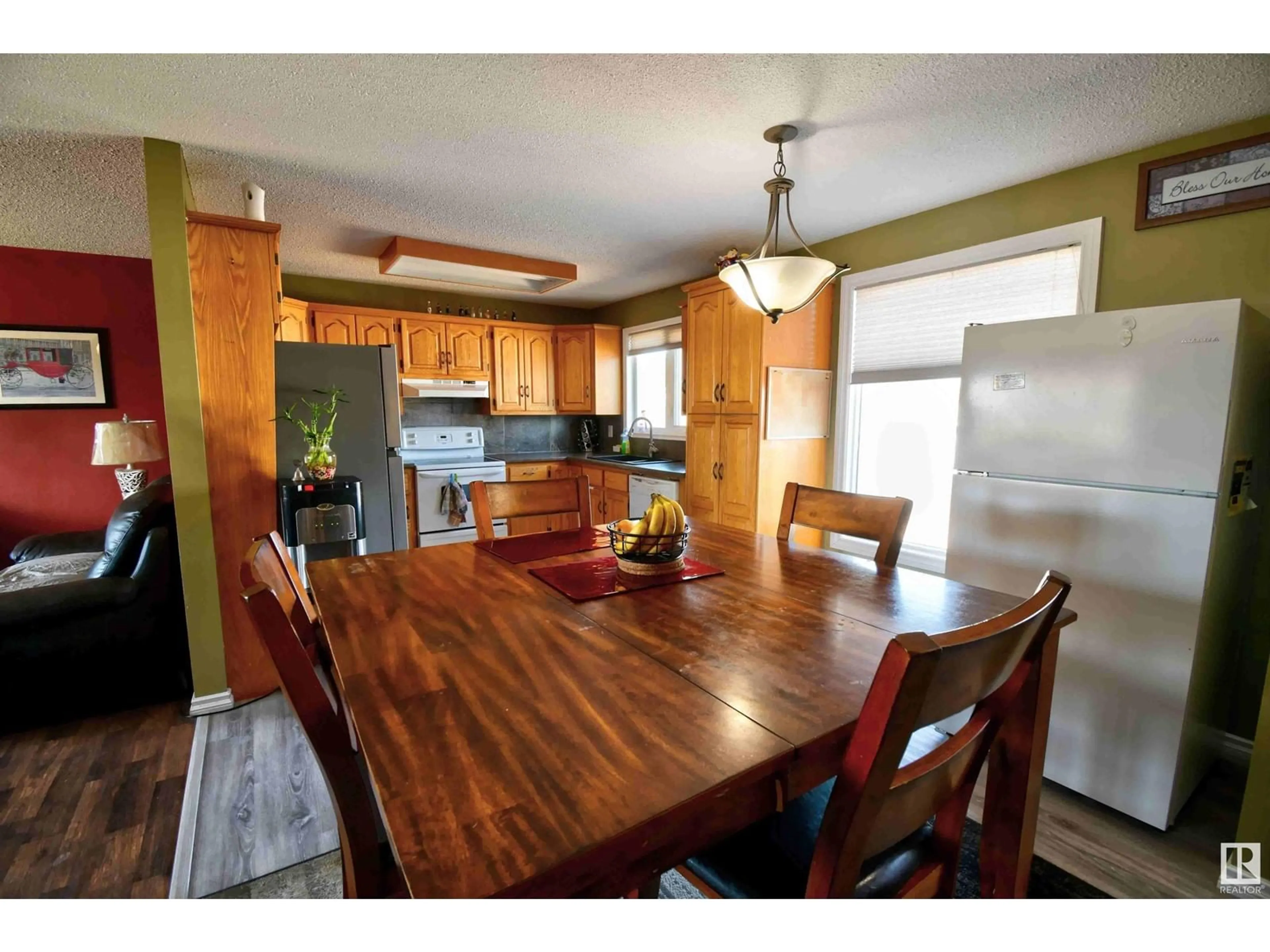 Open concept kitchen, wood/laminate floor for 4014A 45 AV, St. Paul Town Alberta T0A3A2