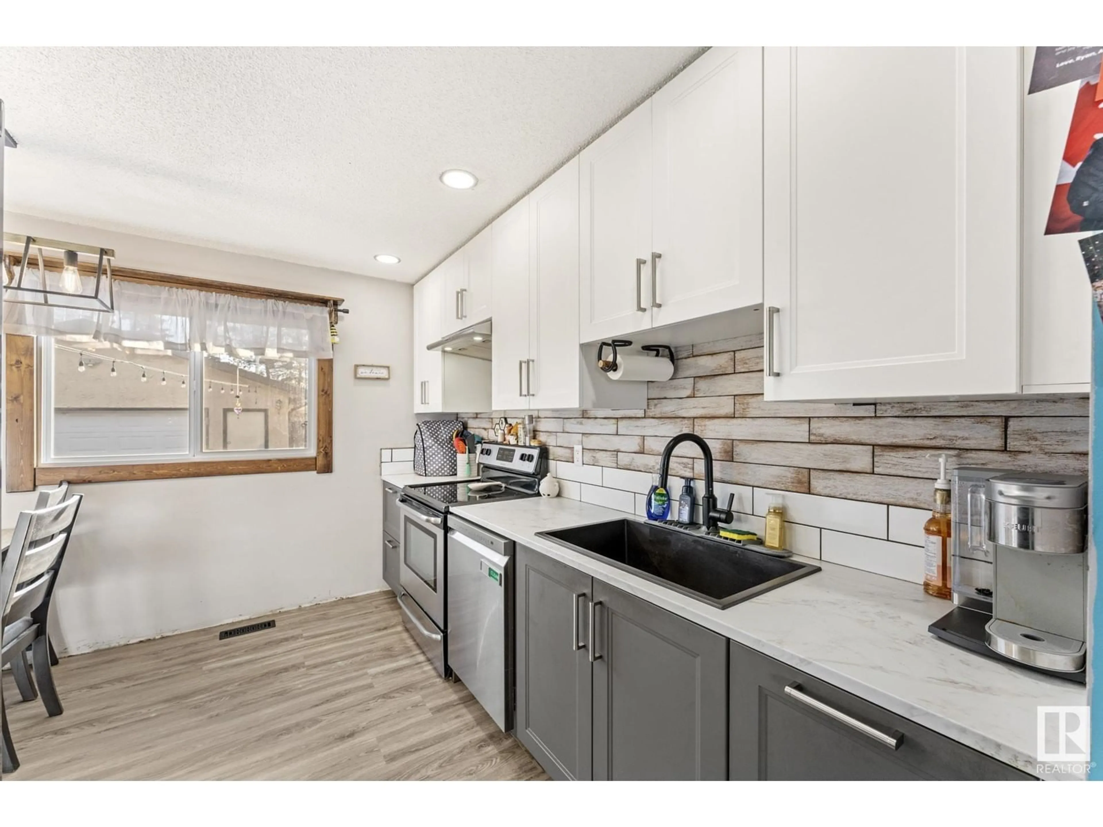 Open concept kitchen, ceramic/tile floor for 17051 98 ST, Edmonton Alberta T5X3G5