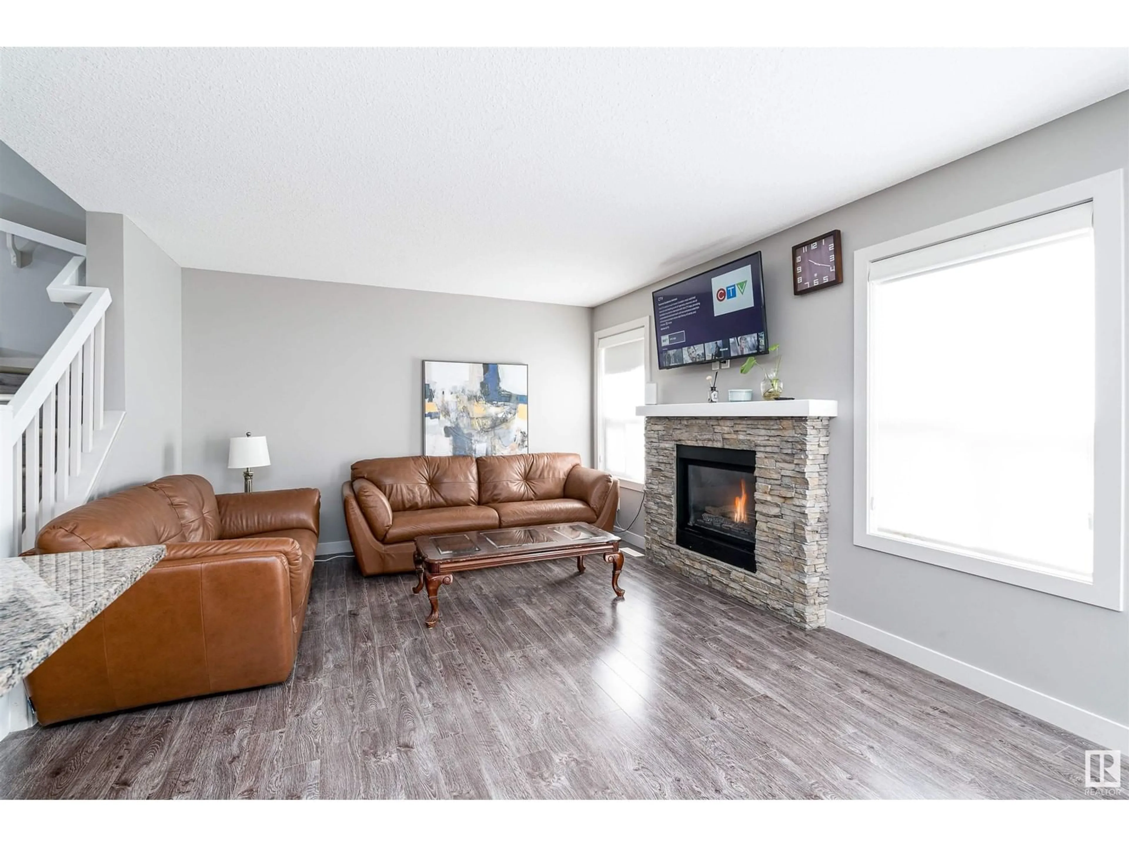 Living room with furniture, wood/laminate floor for NW - 1645 HAMMOND CR, Edmonton Alberta T6M0L8