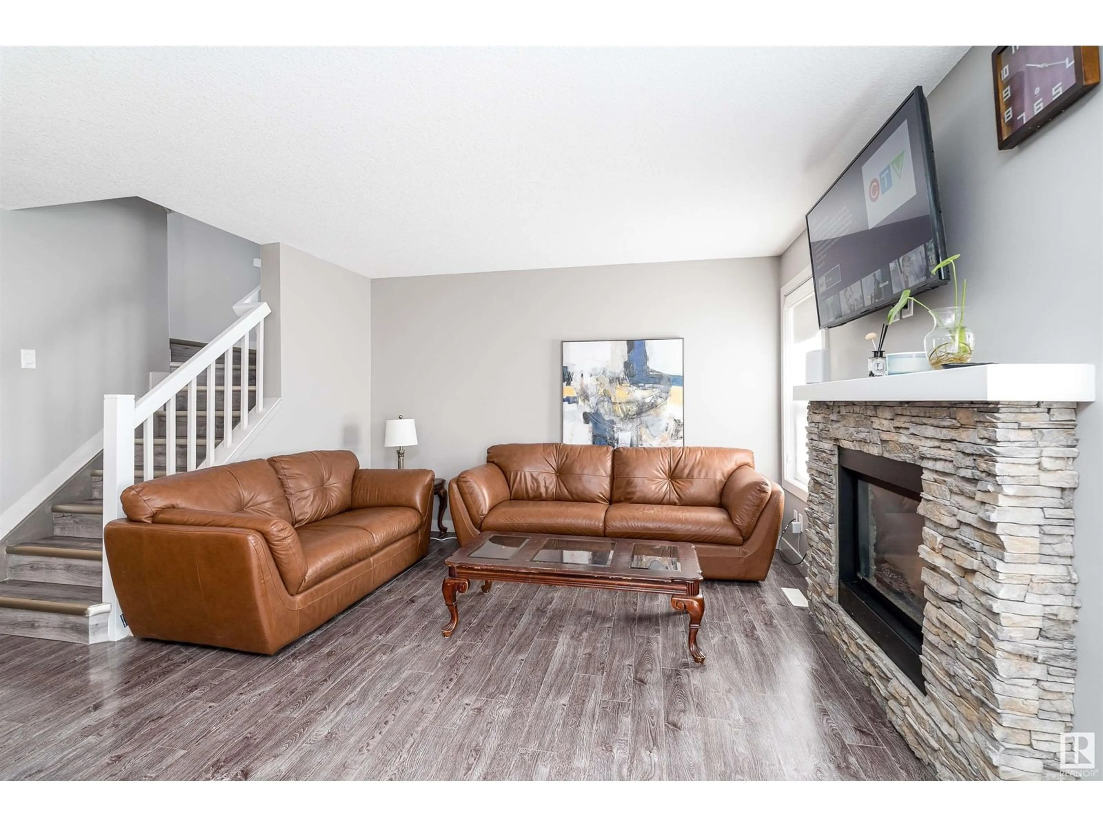 Living room with furniture, wood/laminate floor for NW - 1645 HAMMOND CR, Edmonton Alberta T6M0L8