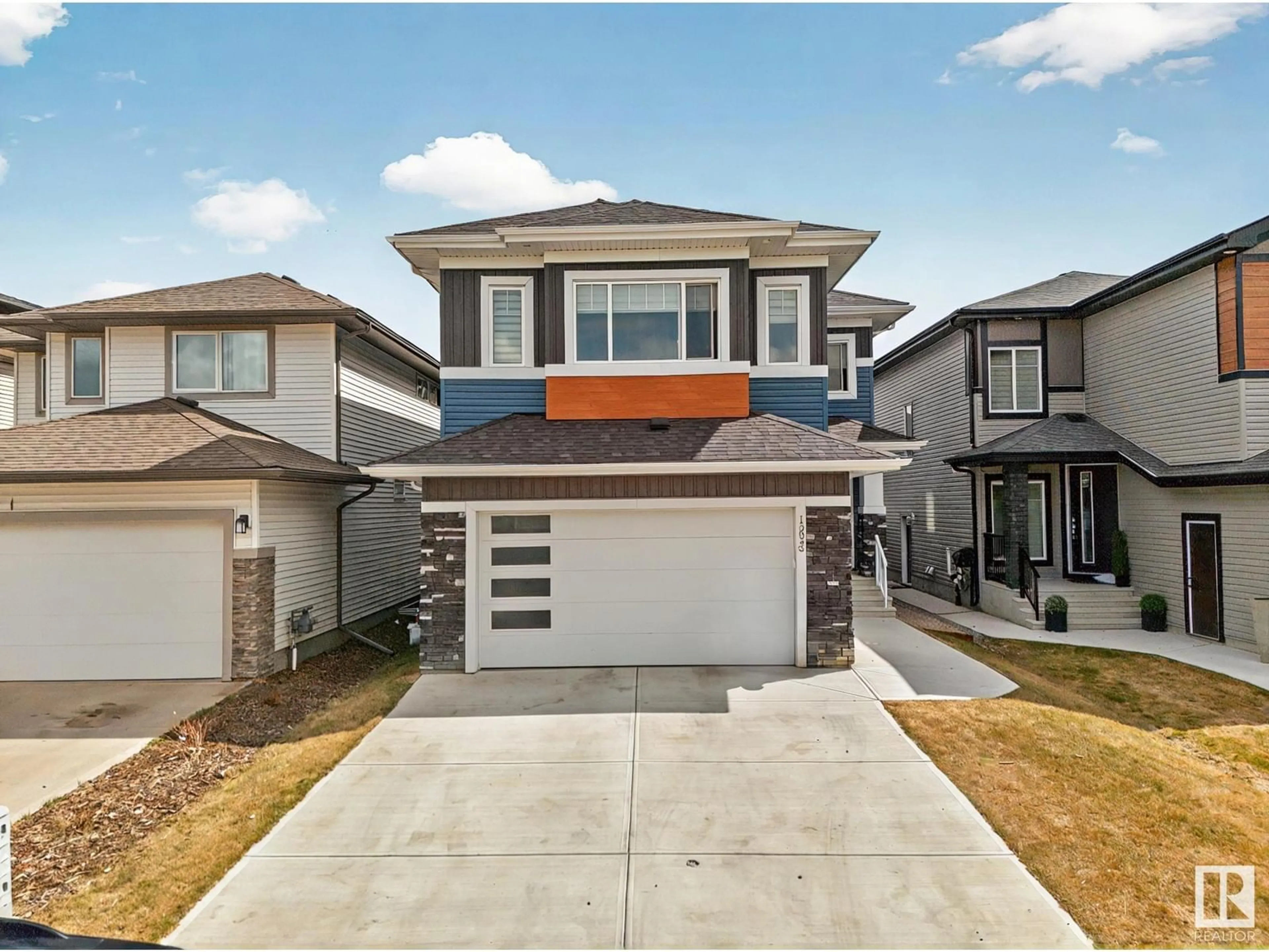 Home with vinyl exterior material, street for 15023 15 ST, Edmonton Alberta T5Y3T4