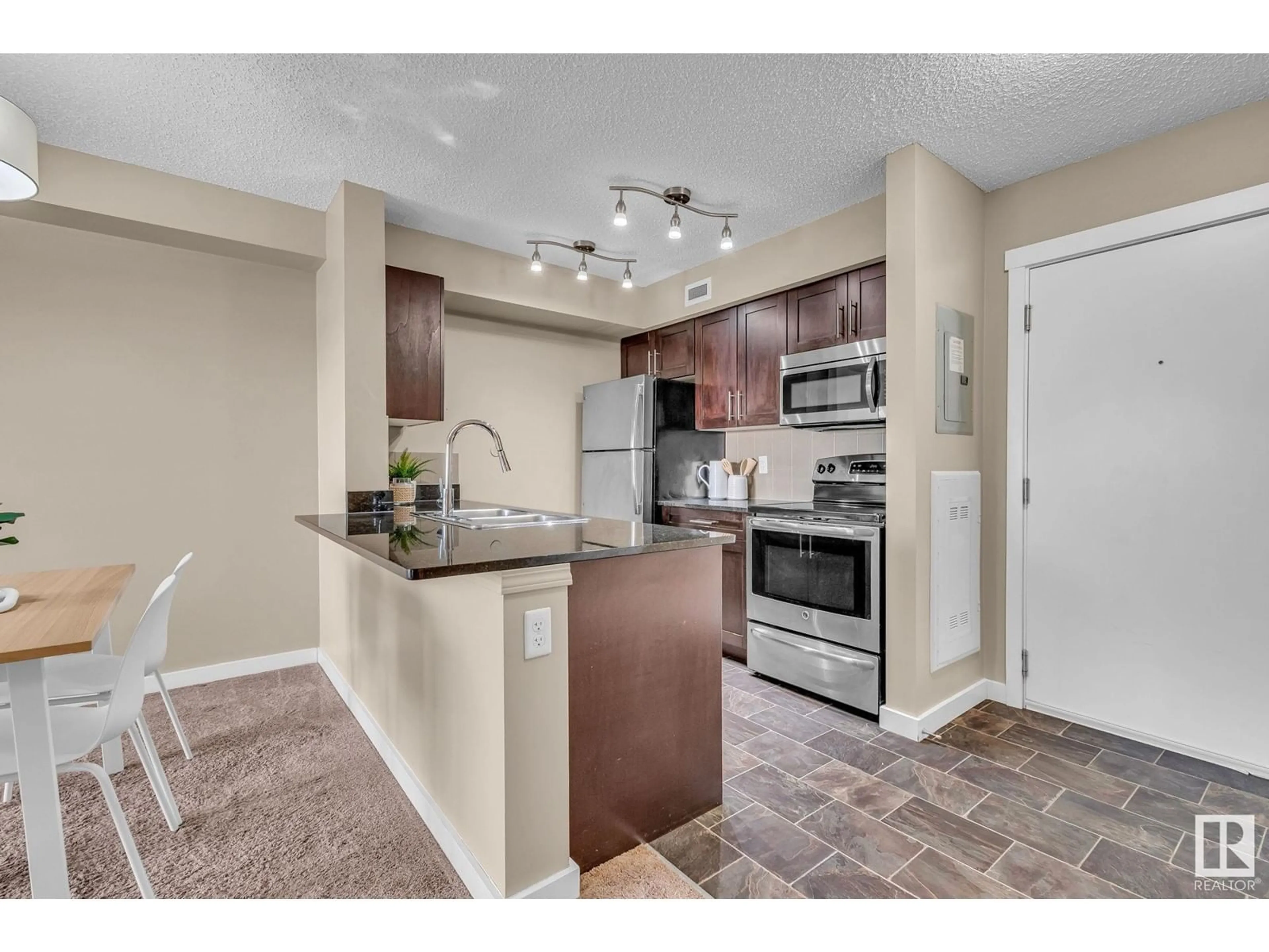 Open concept kitchen, ceramic/tile floor for SW - 423 12025 22 AV, Edmonton Alberta T6W2Y1