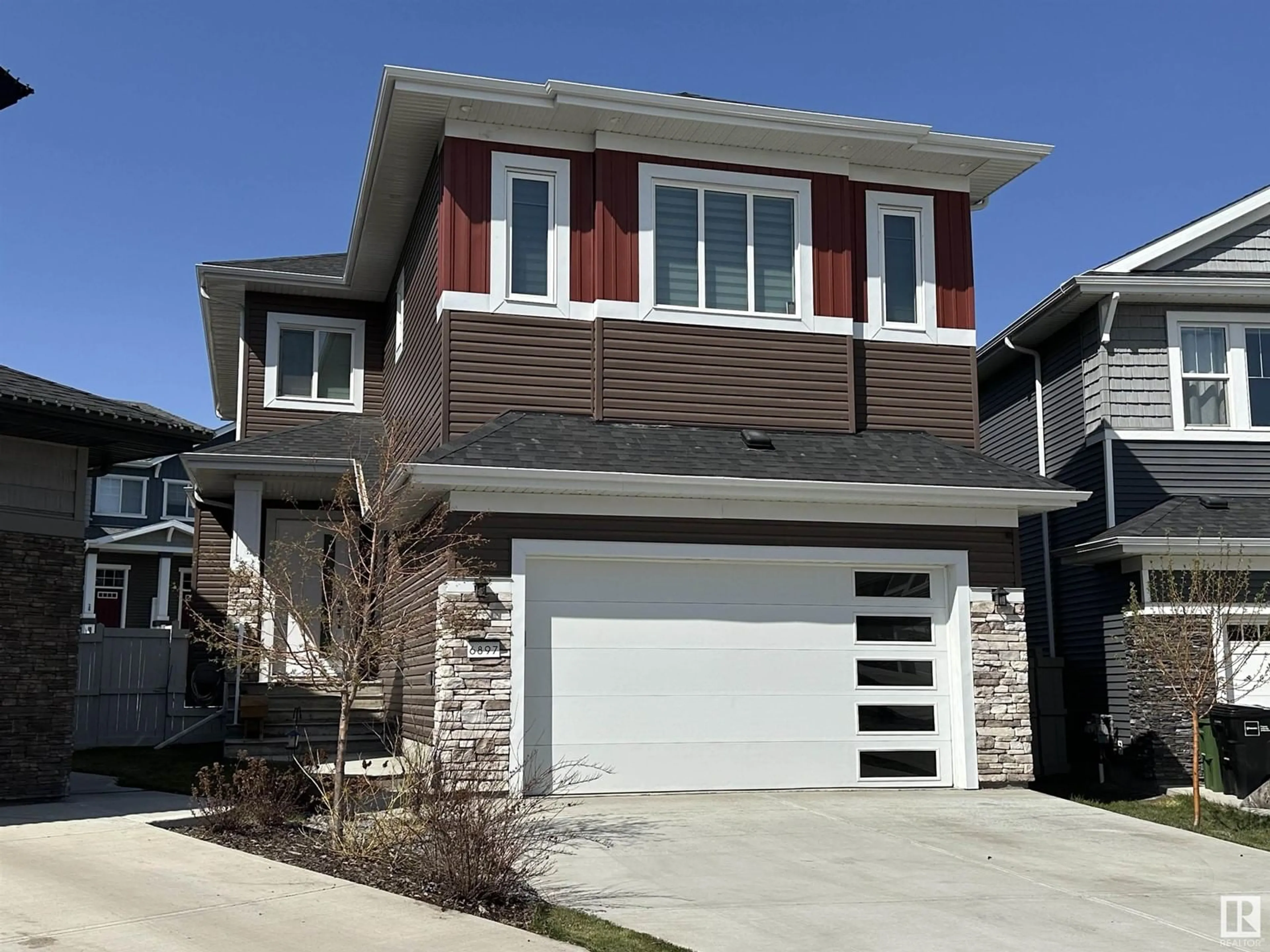 Home with brick exterior material, street for NW - 6897 EVANS WD, Edmonton Alberta T6M2N5