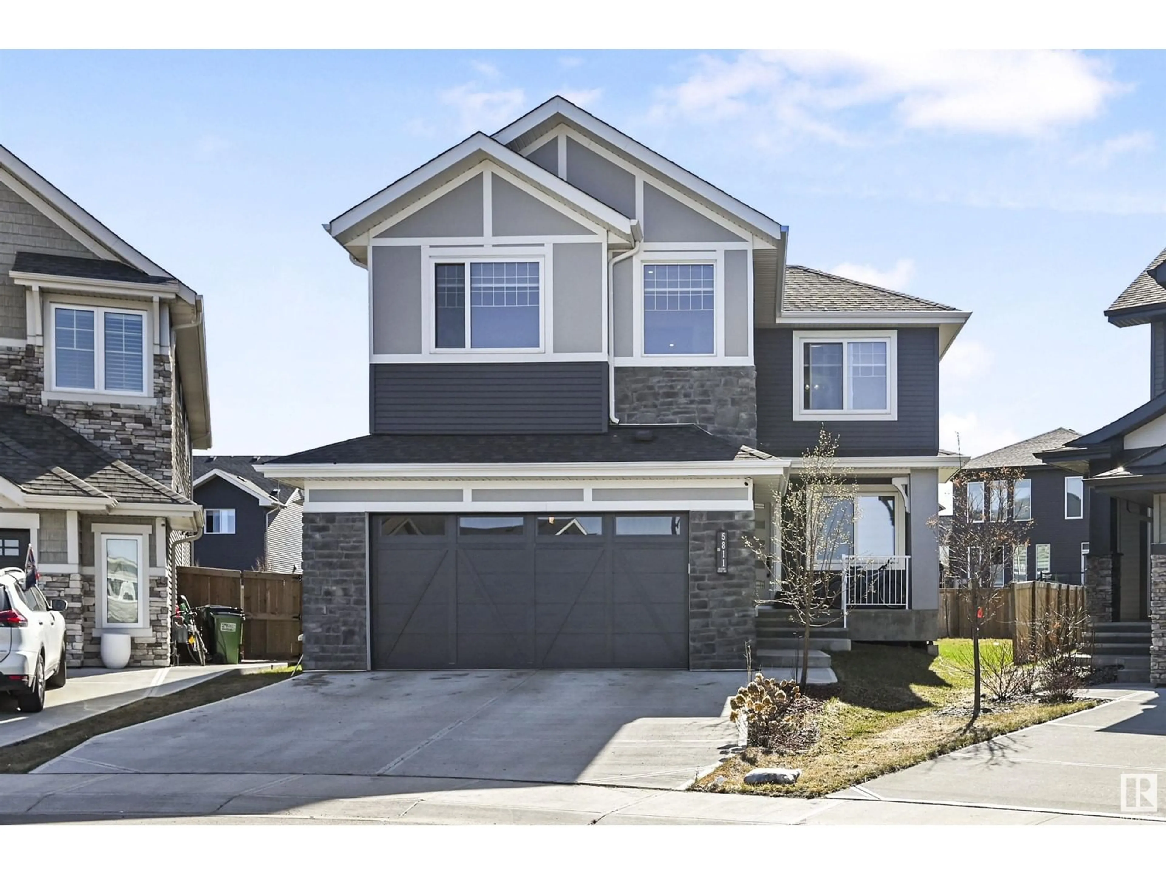 Home with vinyl exterior material, street for 5811 KEEPING CO SW, Edmonton Alberta T6W4K4