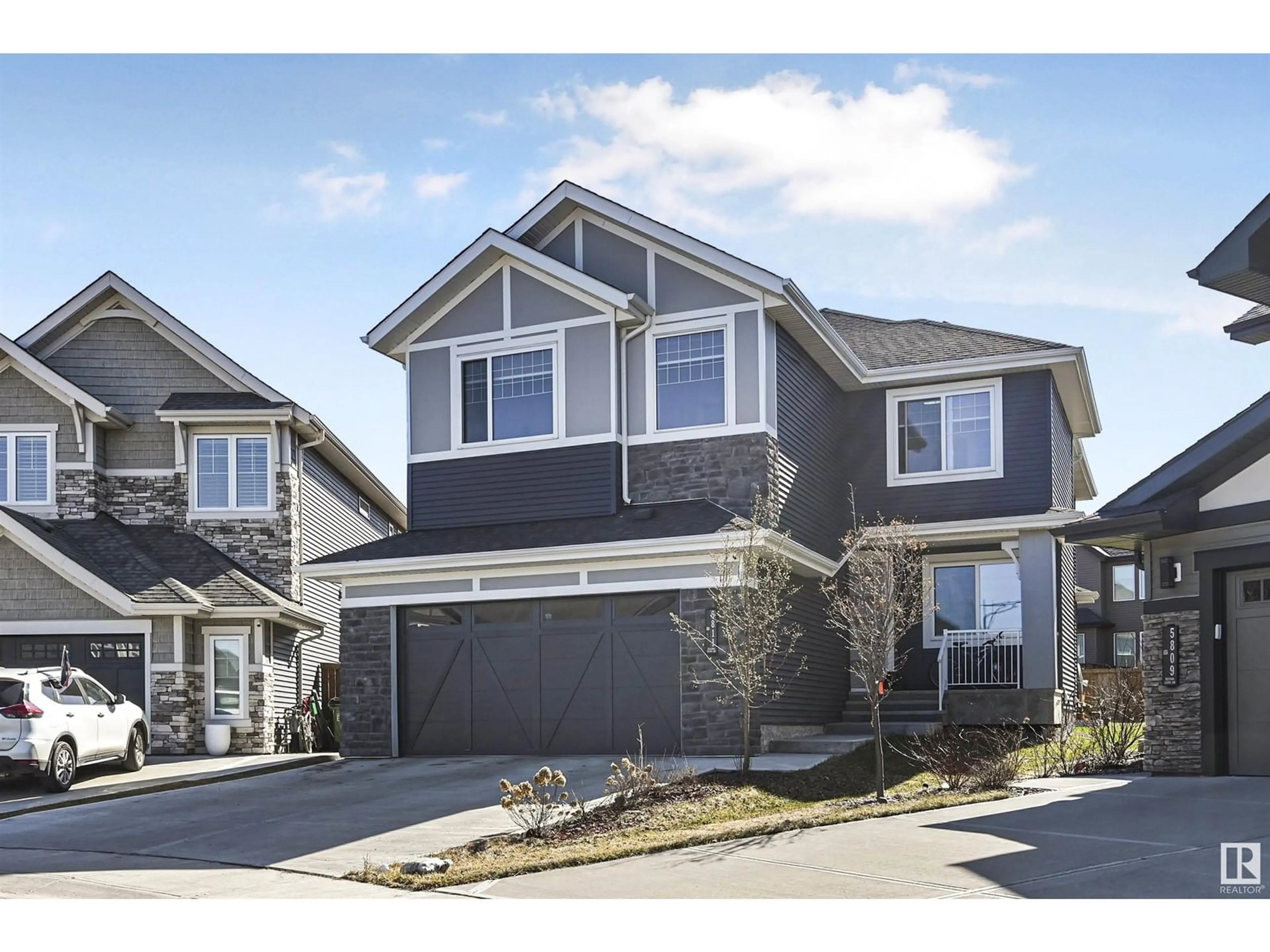 Home with vinyl exterior material, street for 5811 KEEPING CO SW, Edmonton Alberta T6W4K4