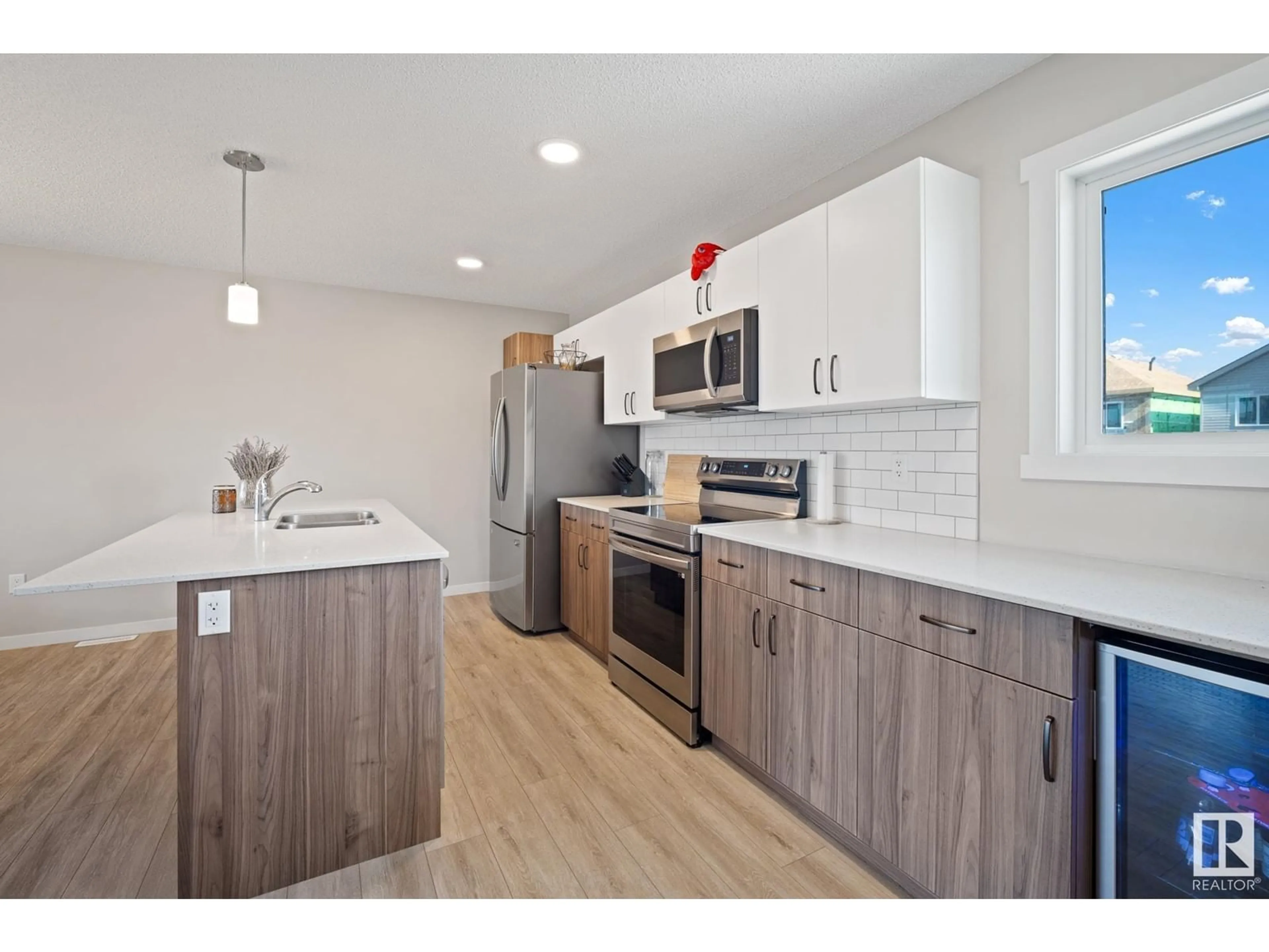Open concept kitchen, wood/laminate floor for 1103 CY BECKER RD, Edmonton Alberta T5Y4B6