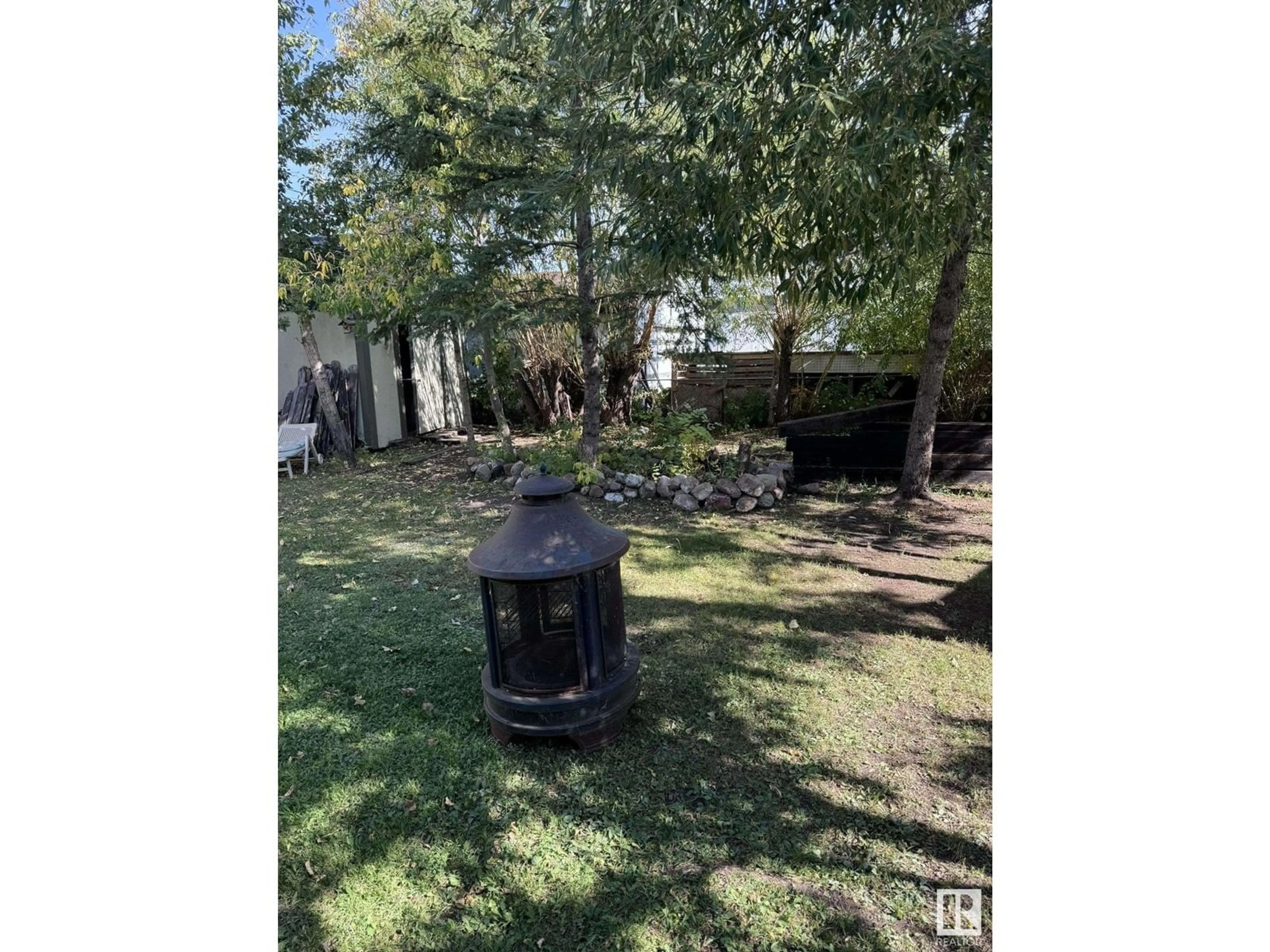 A pic from outside/outdoor area/front of a property/back of a property/a pic from drone, forest/trees view for 4740 50 AV, Clyde Alberta T0G0P0