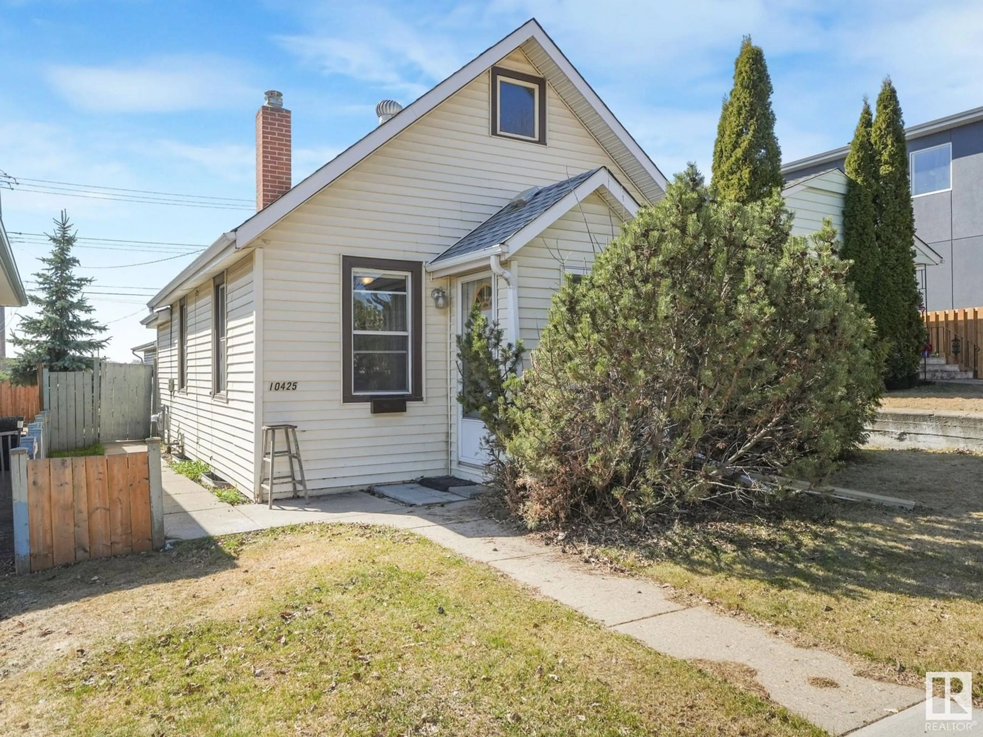 Home with vinyl exterior material, street for 10425 64 AV, Edmonton Alberta T6H1S8