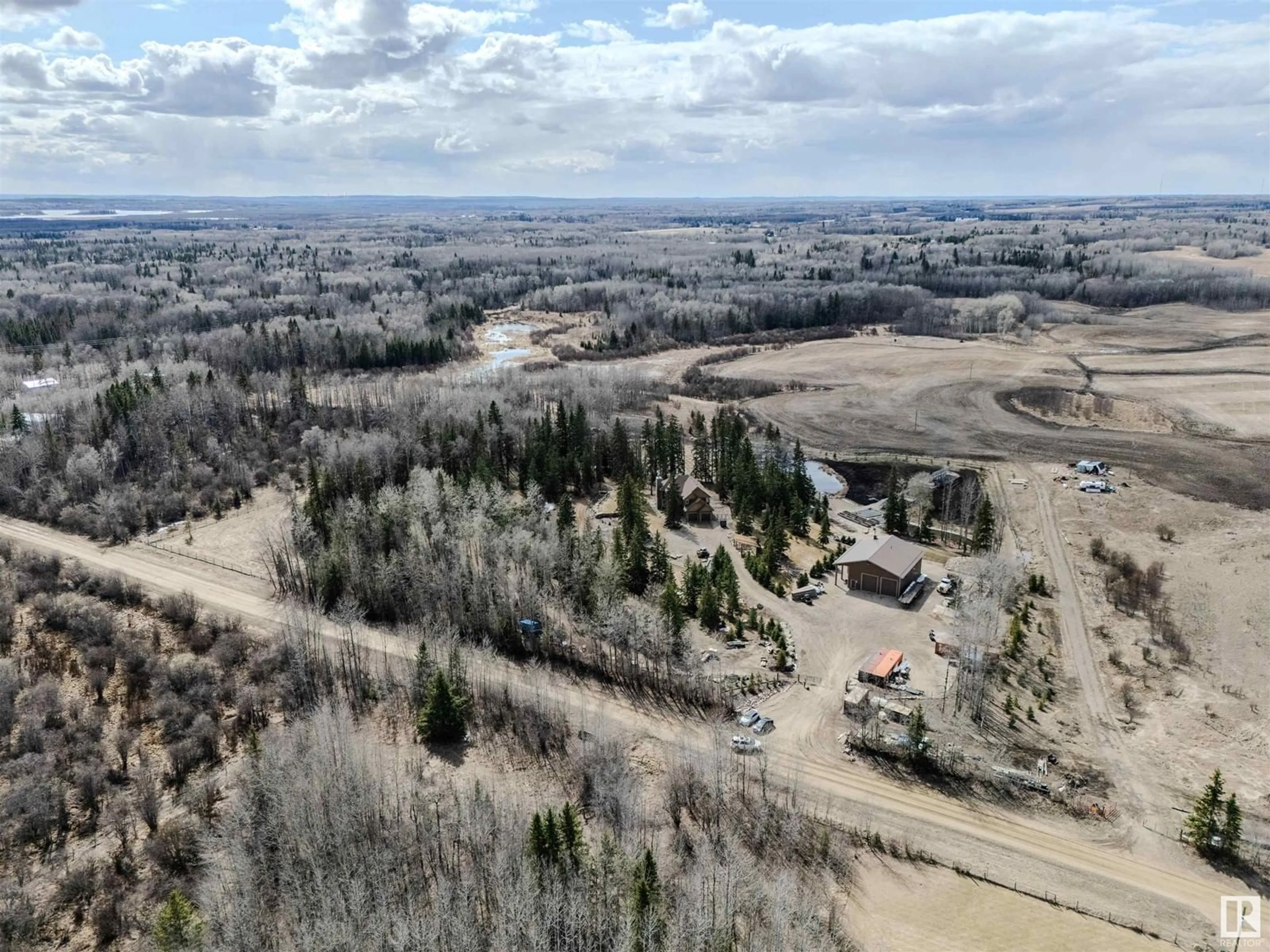 A pic from outside/outdoor area/front of a property/back of a property/a pic from drone, mountain view for 53226 RGE ROAD 24, Rural Parkland County Alberta T7Y0C9