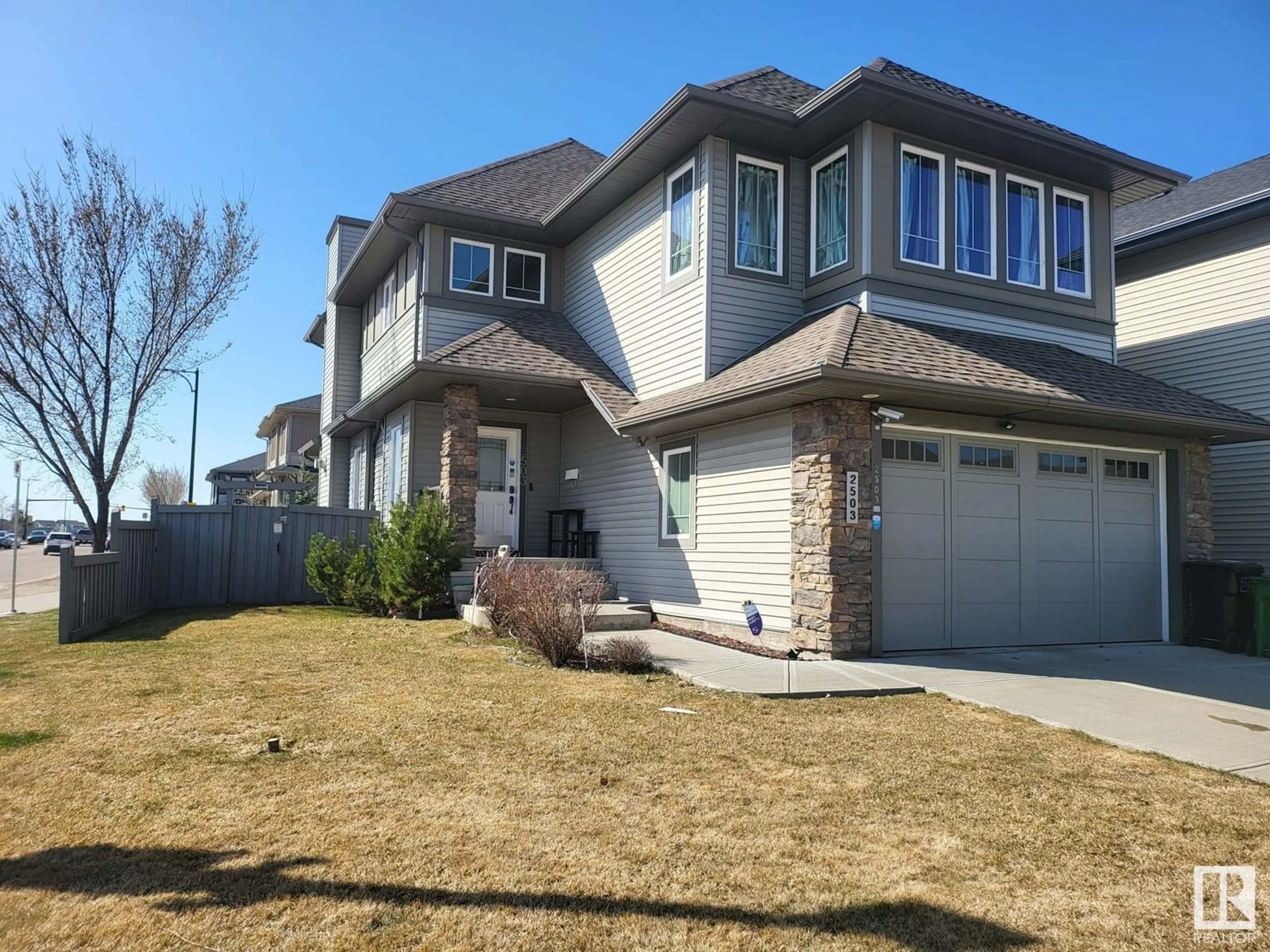 Home with vinyl exterior material, street for 2503 ANDERSON WY, Edmonton Alberta T6W0L6