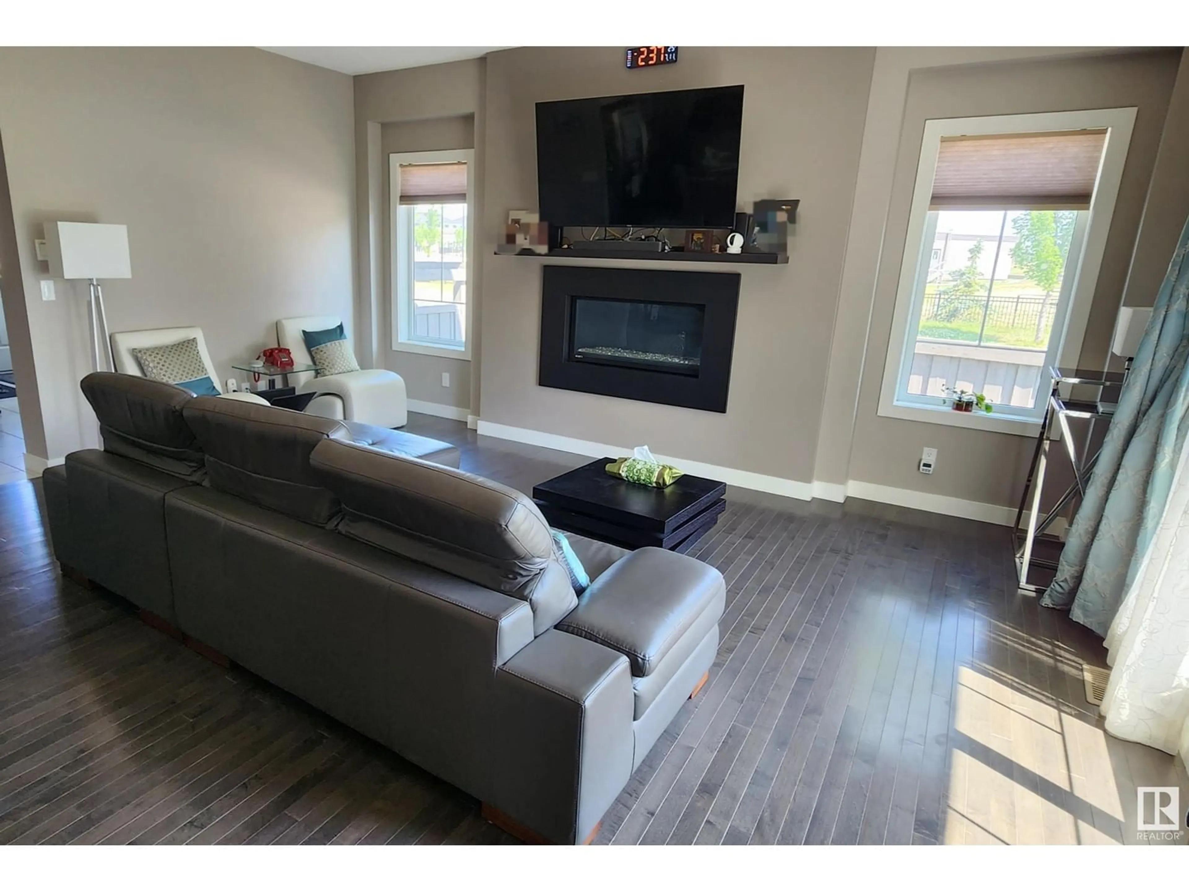 Living room with furniture, wood/laminate floor for 2503 ANDERSON WY, Edmonton Alberta T6W0L6