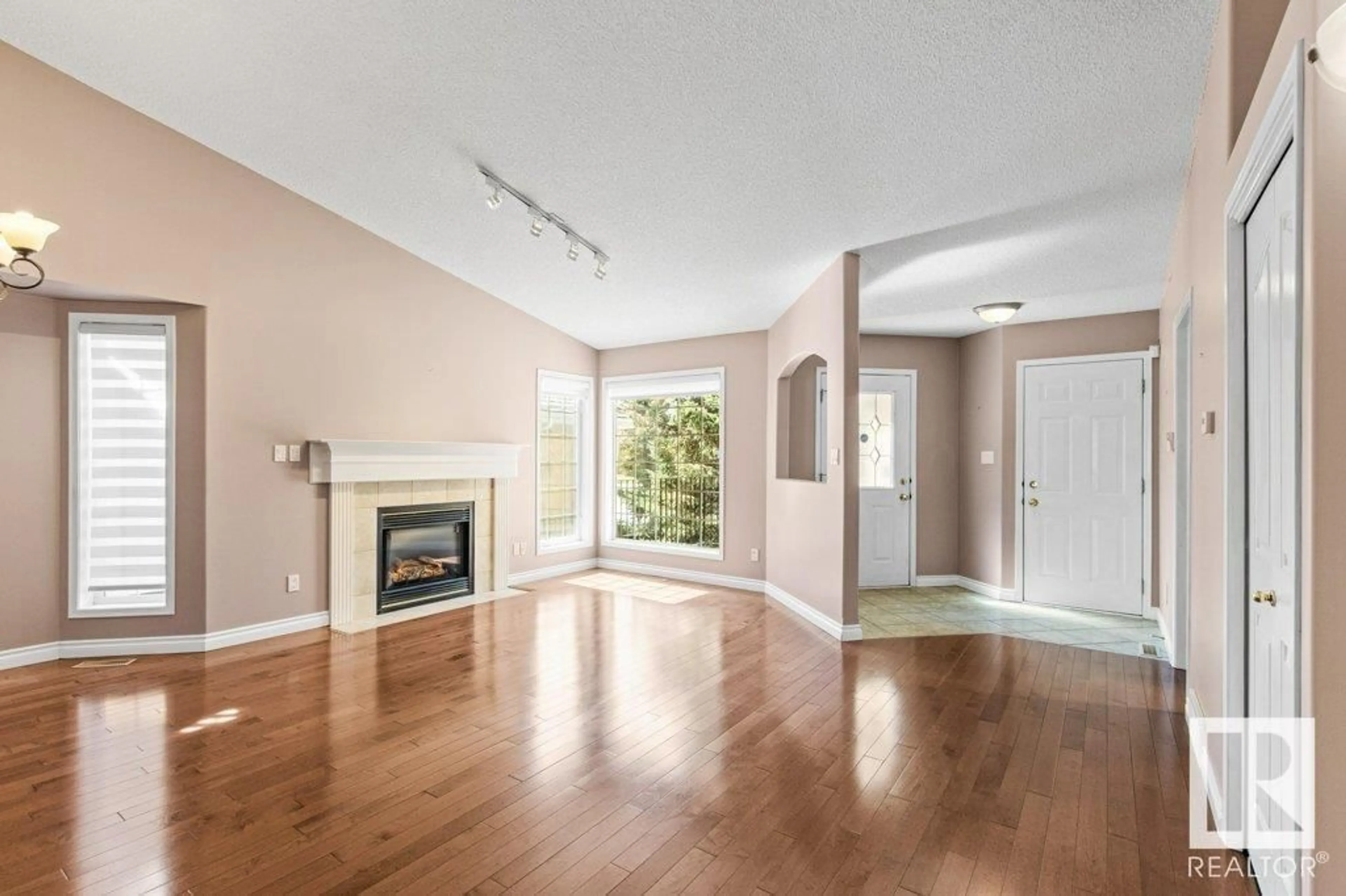 Living room with furniture, wood/laminate floor for #6 - 920 119 ST, Edmonton Alberta T6J7H1