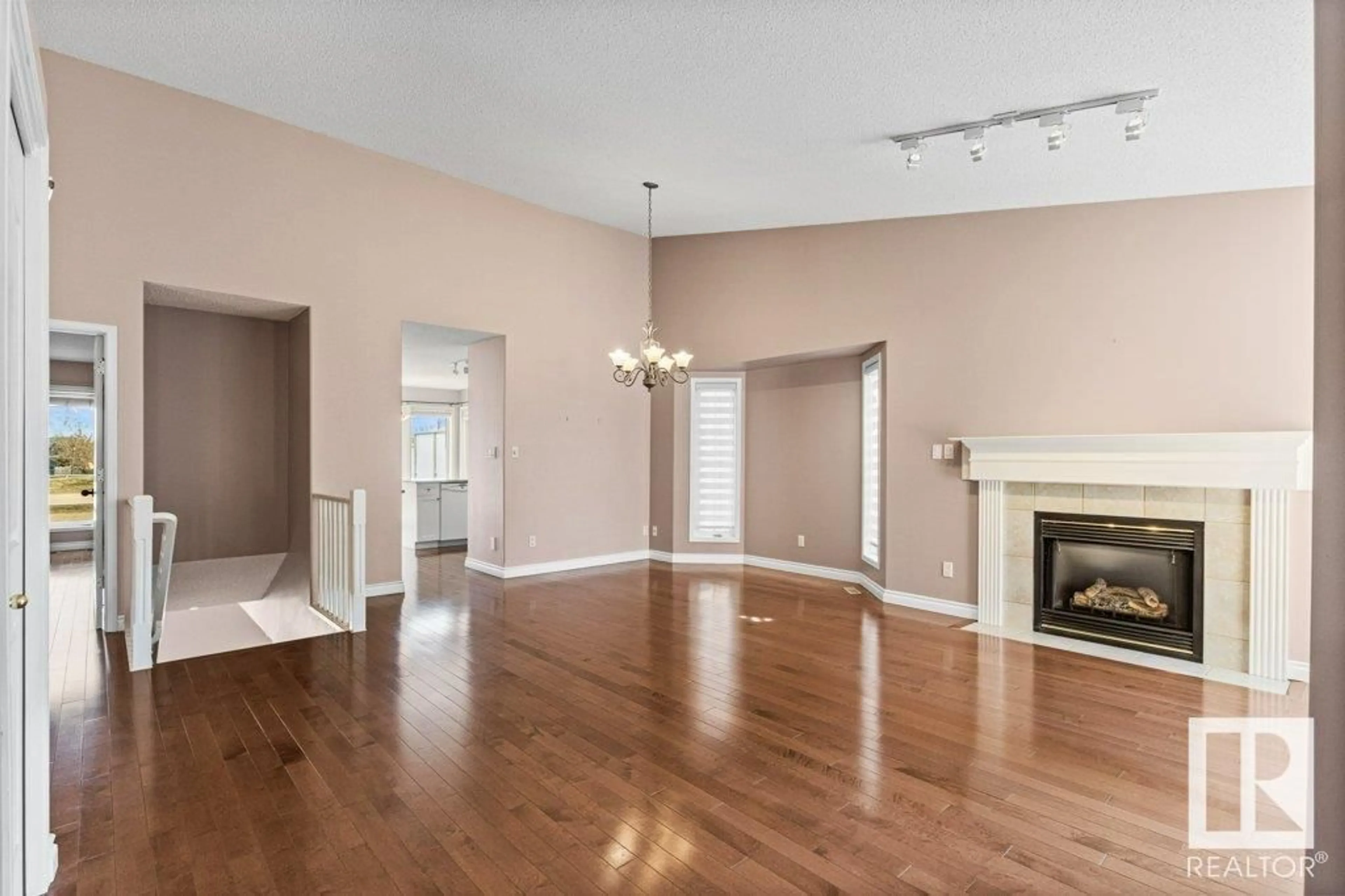 Living room with furniture, wood/laminate floor for #6 - 920 119 ST, Edmonton Alberta T6J7H1