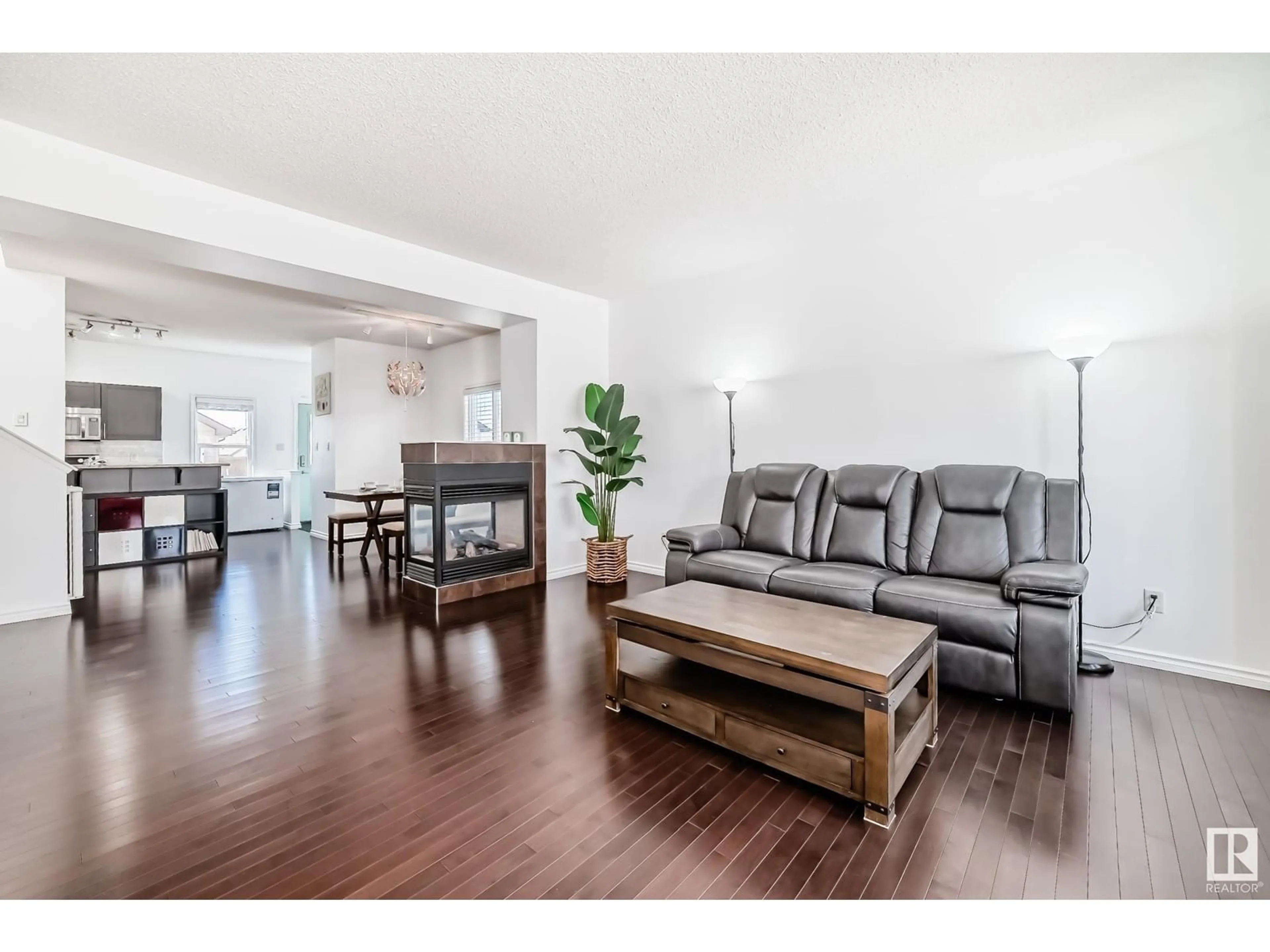 Living room with furniture, wood/laminate floor for 1624 57 ST, Edmonton Alberta T6X1P9
