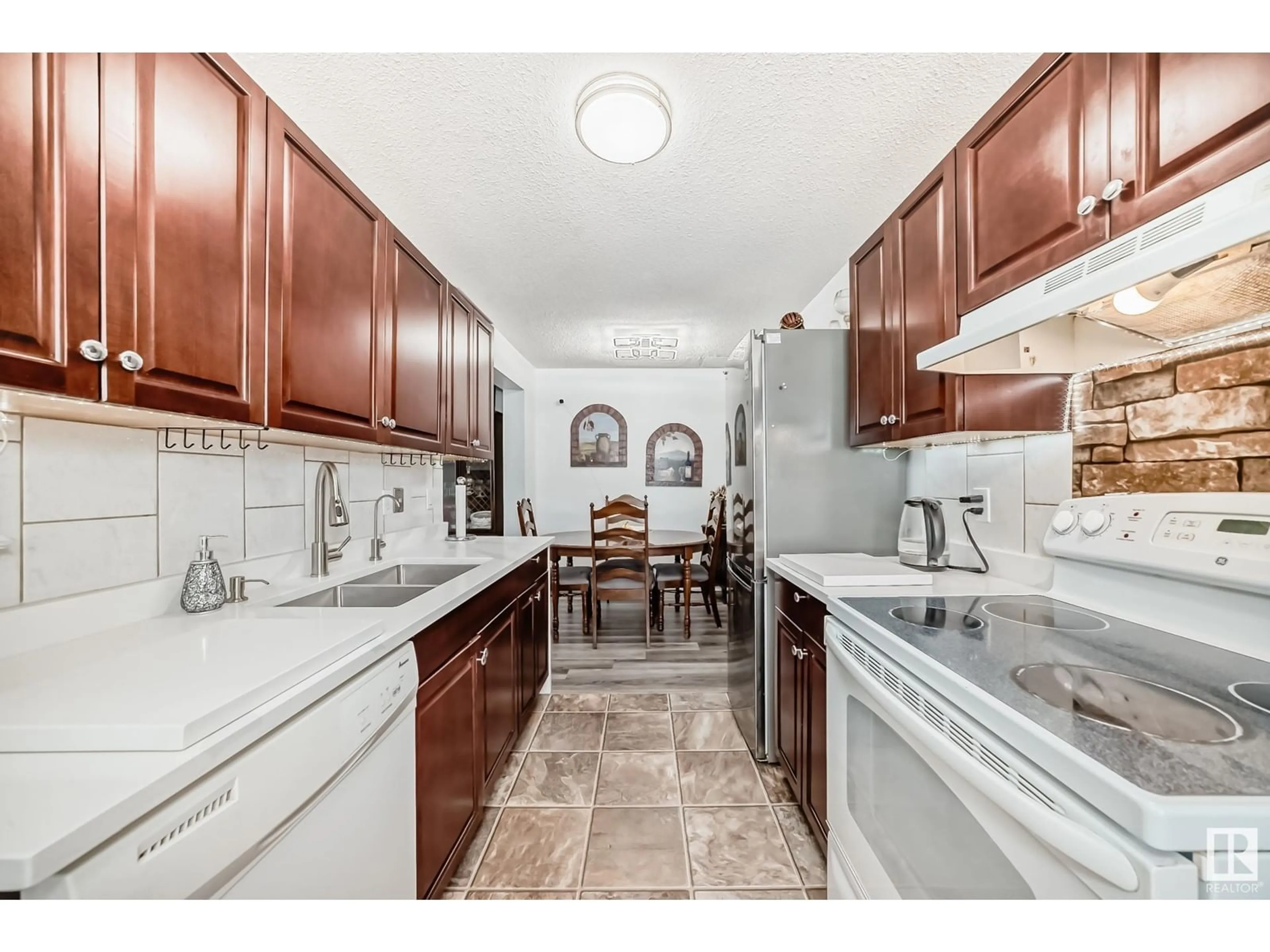 Open concept kitchen, ceramic/tile floor for 217 CALLINGWOOD TWO NW, Edmonton Alberta T5T1A3