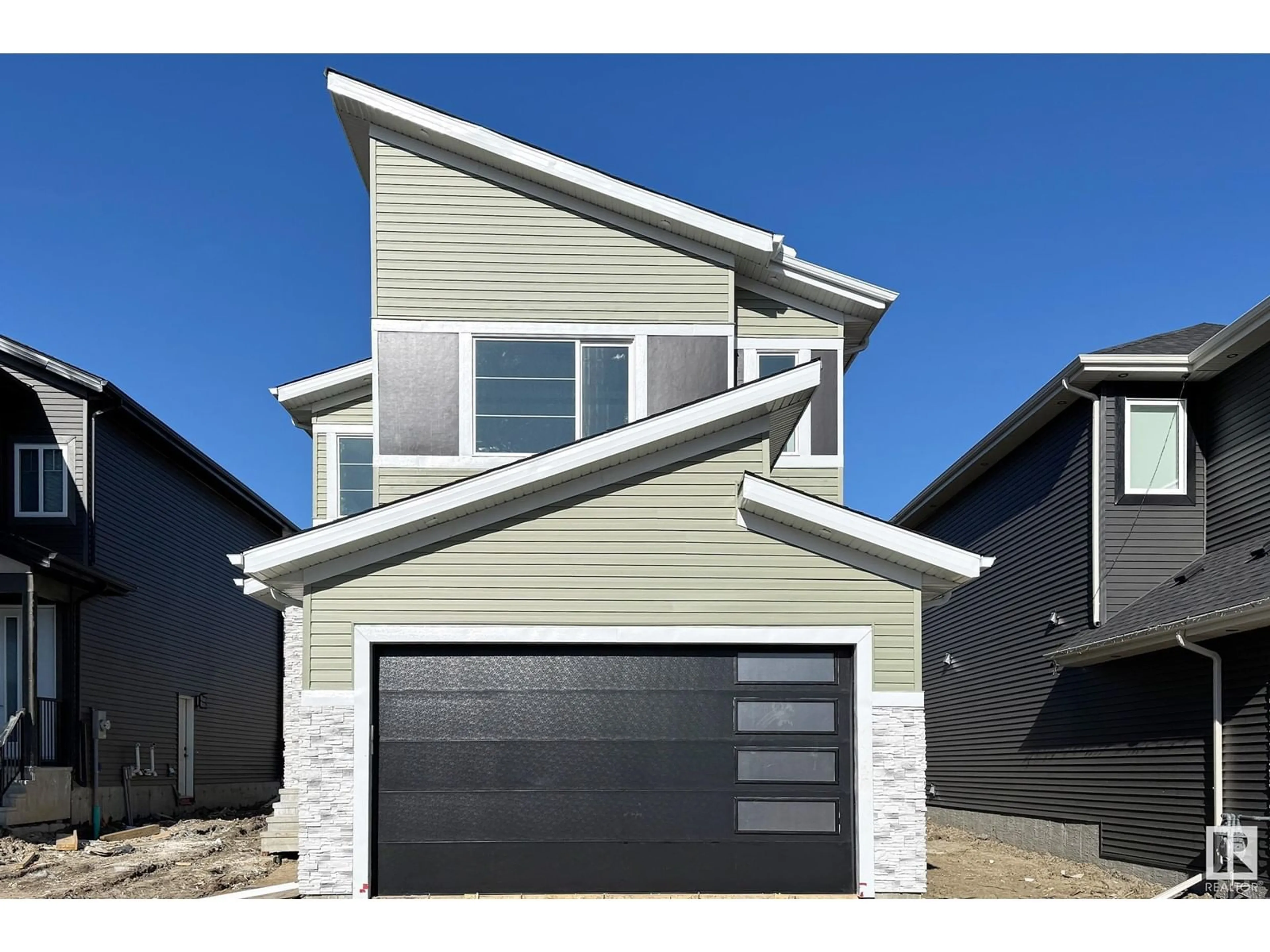 Home with vinyl exterior material, street for 5943 17 ST, Rural Leduc County Alberta T4X3C4