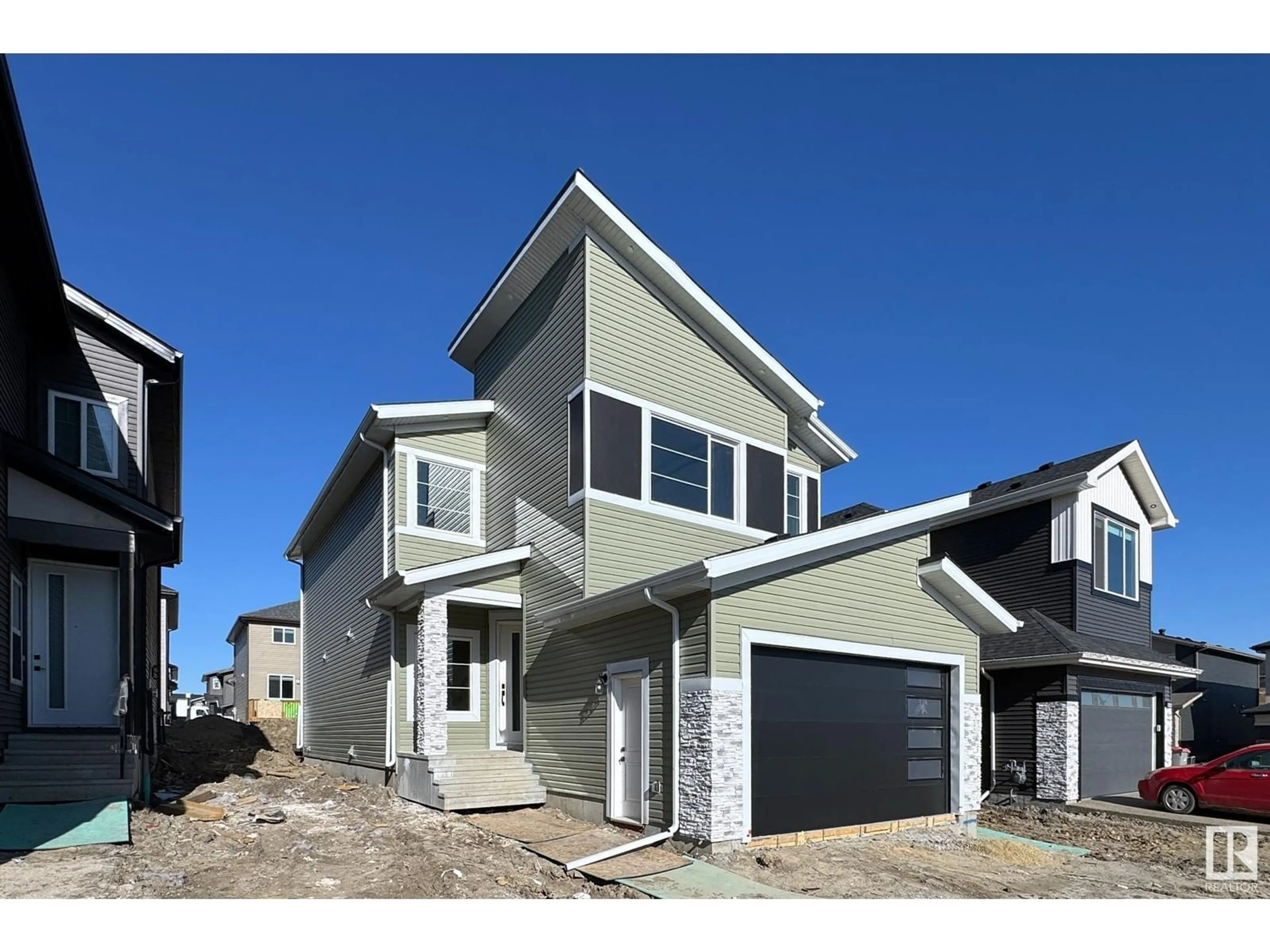 Home with vinyl exterior material, street for 5943 17 ST, Rural Leduc County Alberta T4X3C4