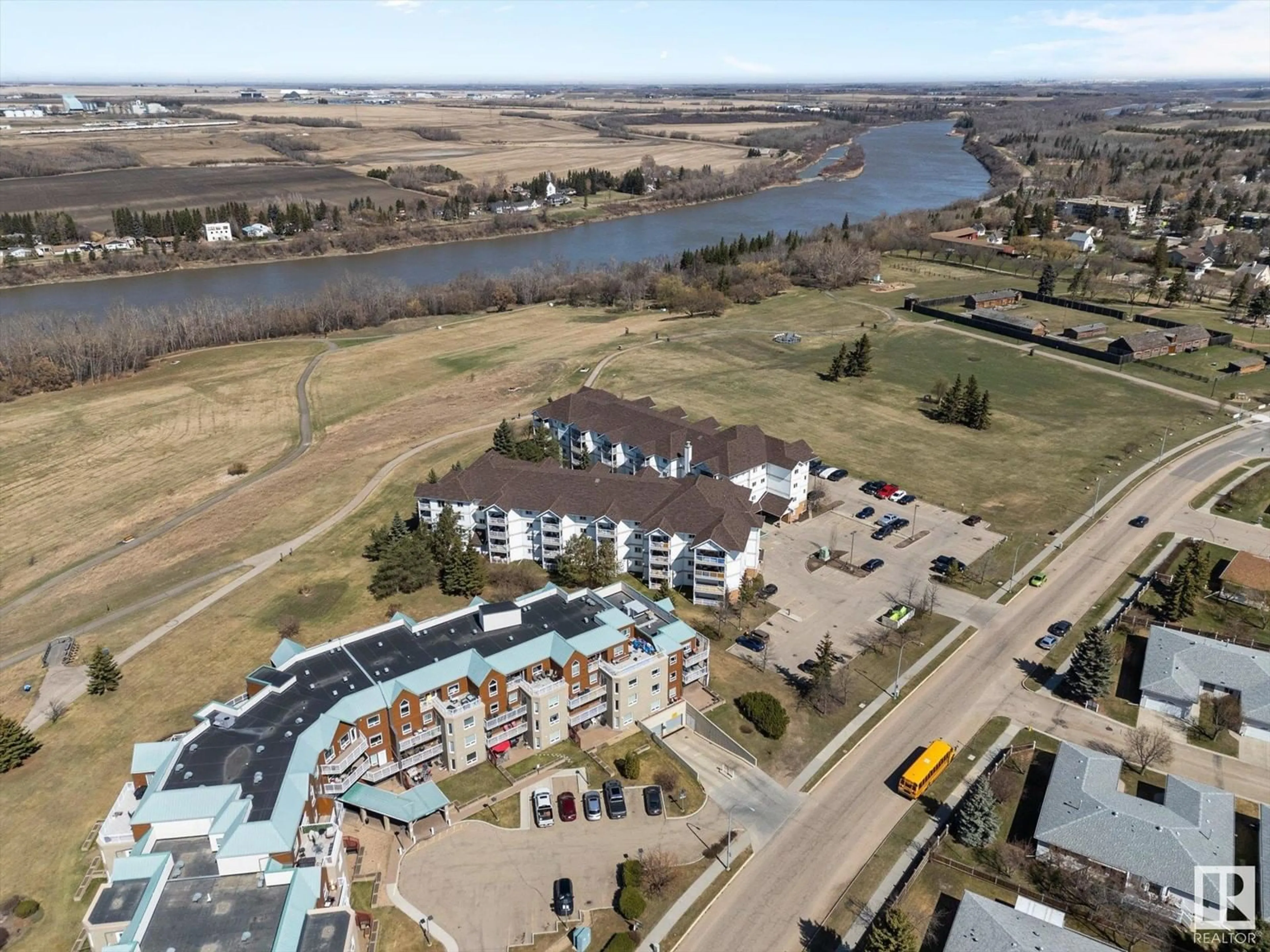 A pic from outside/outdoor area/front of a property/back of a property/a pic from drone, water/lake/river/ocean view for 218 - 9926 100 AV, Fort Saskatchewan Alberta T8L4E3