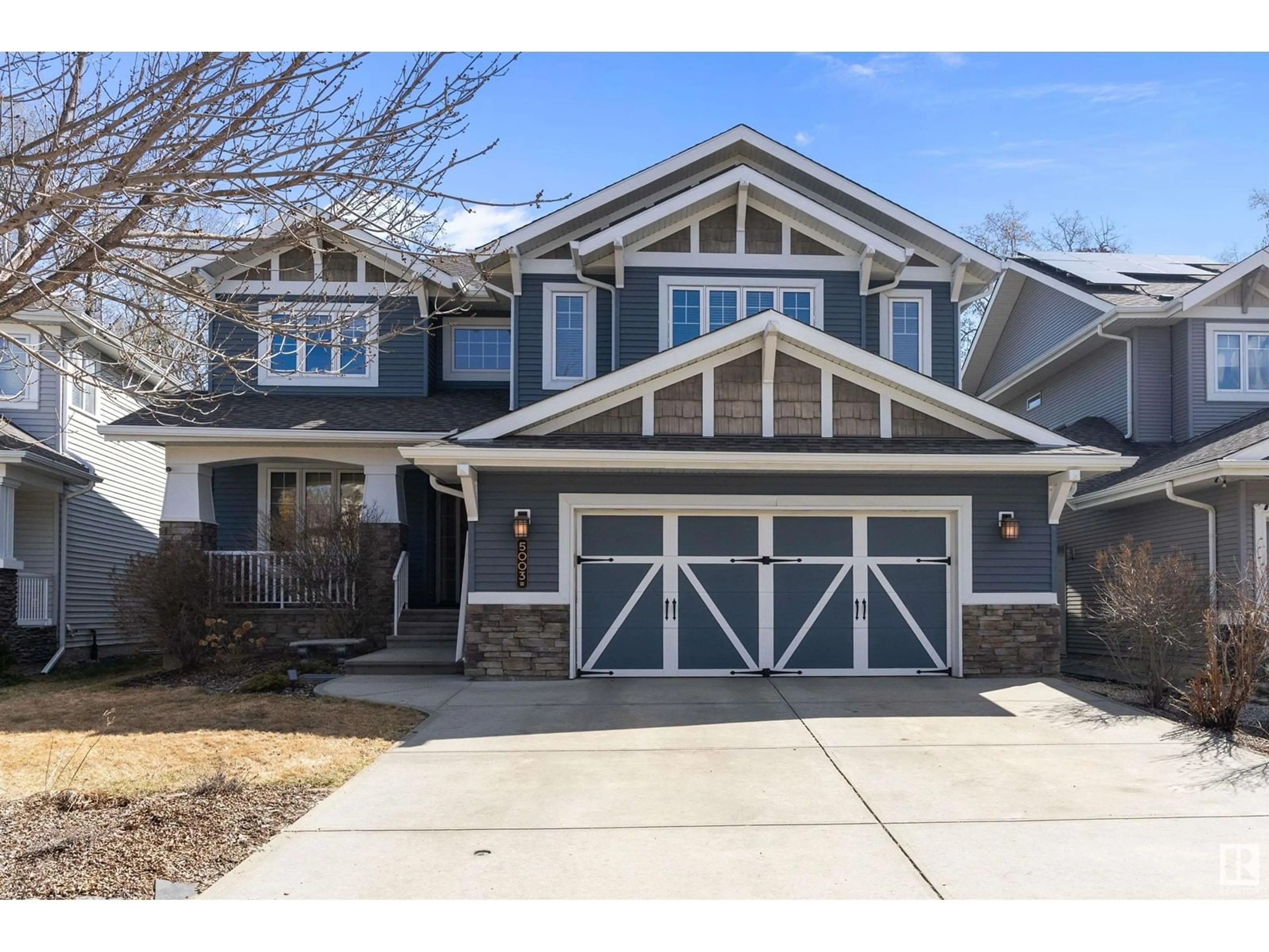 Home with brick exterior material, street for NW - 5003 210 ST, Edmonton Alberta T6M0A8