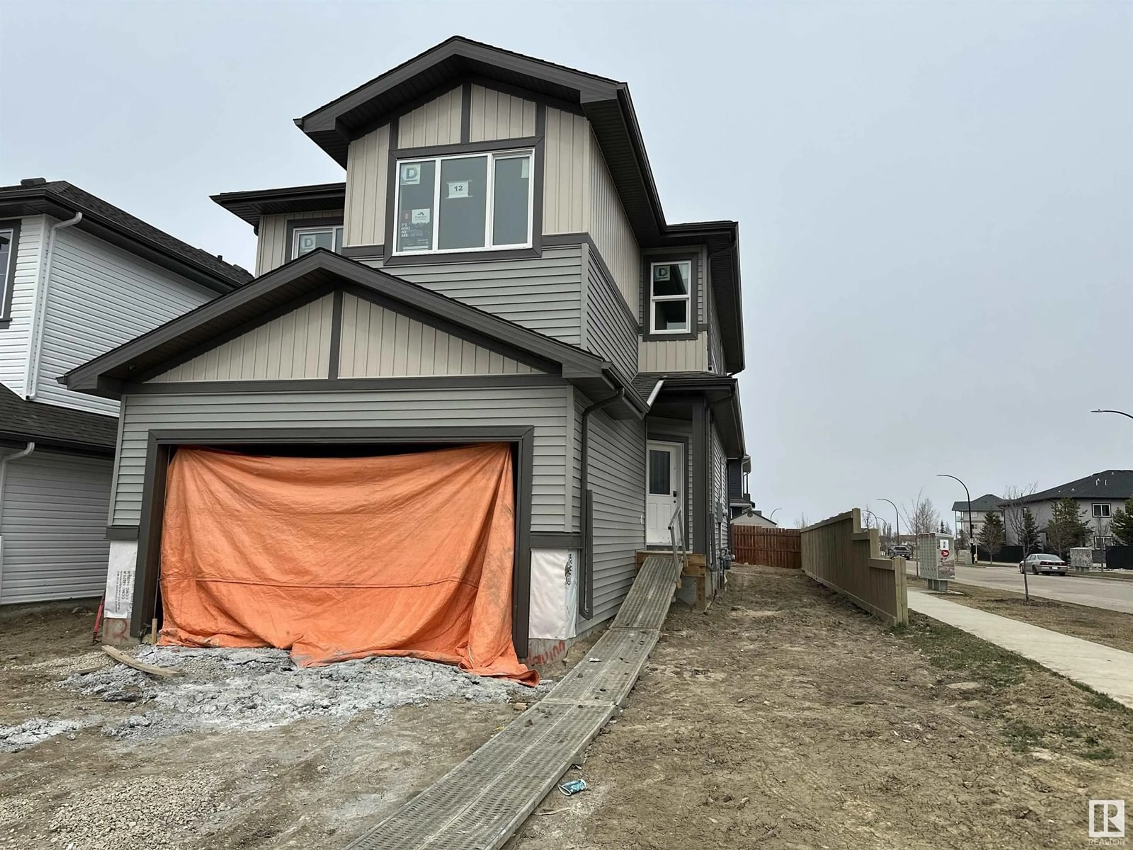 Home with vinyl exterior material, street for 12 SPRINGBROOK WD, Spruce Grove Alberta T7X2W5