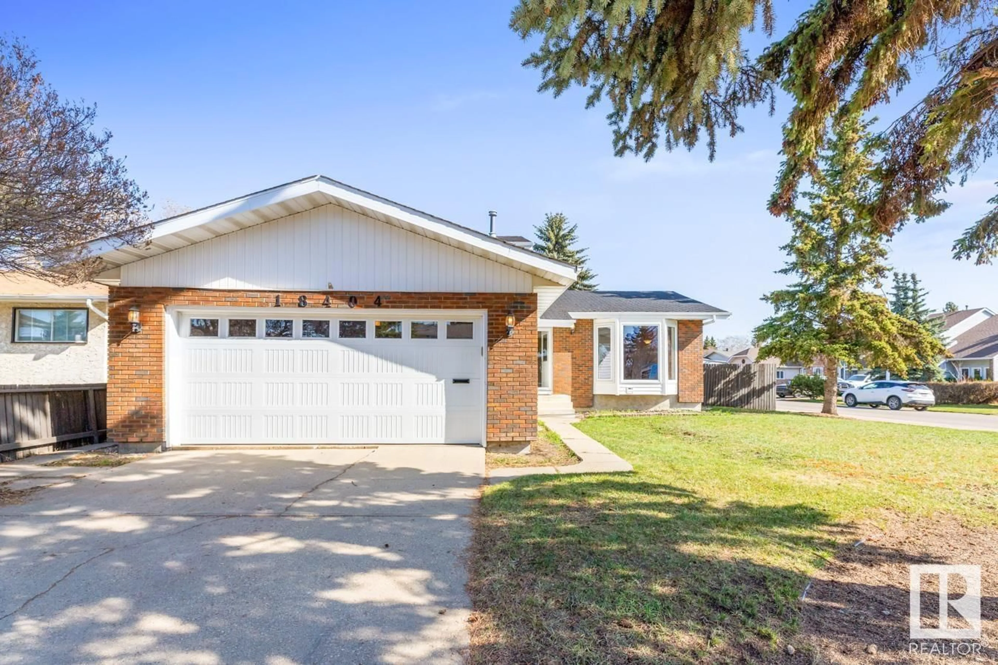 Home with vinyl exterior material, street for 18404 80 AV, Edmonton Alberta T5T1E9