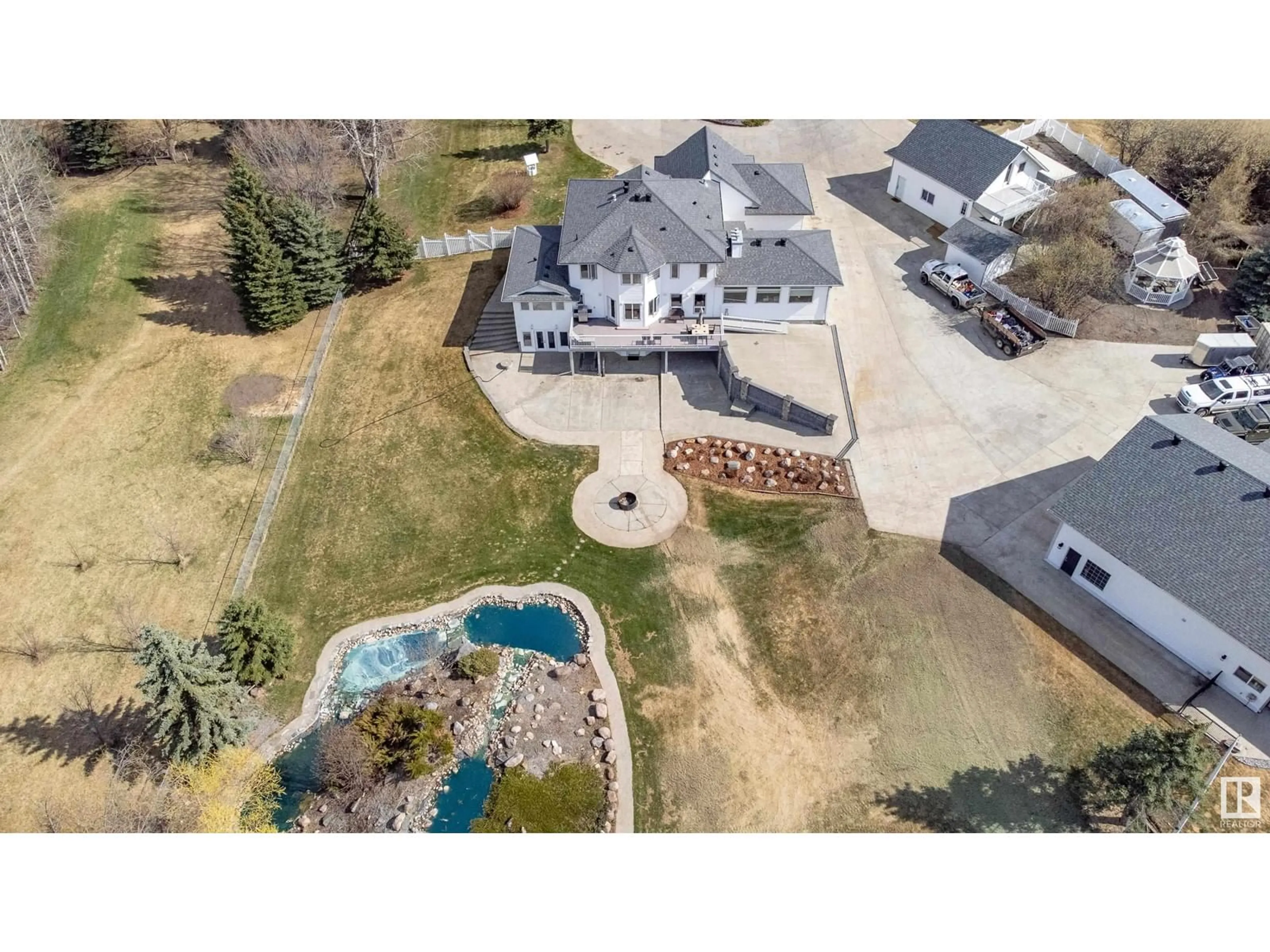 A pic from outside/outdoor area/front of a property/back of a property/a pic from drone, water/lake/river/ocean view for 52458 - 397 RGE ROAD 223, Rural Strathcona County Alberta T8A5V1