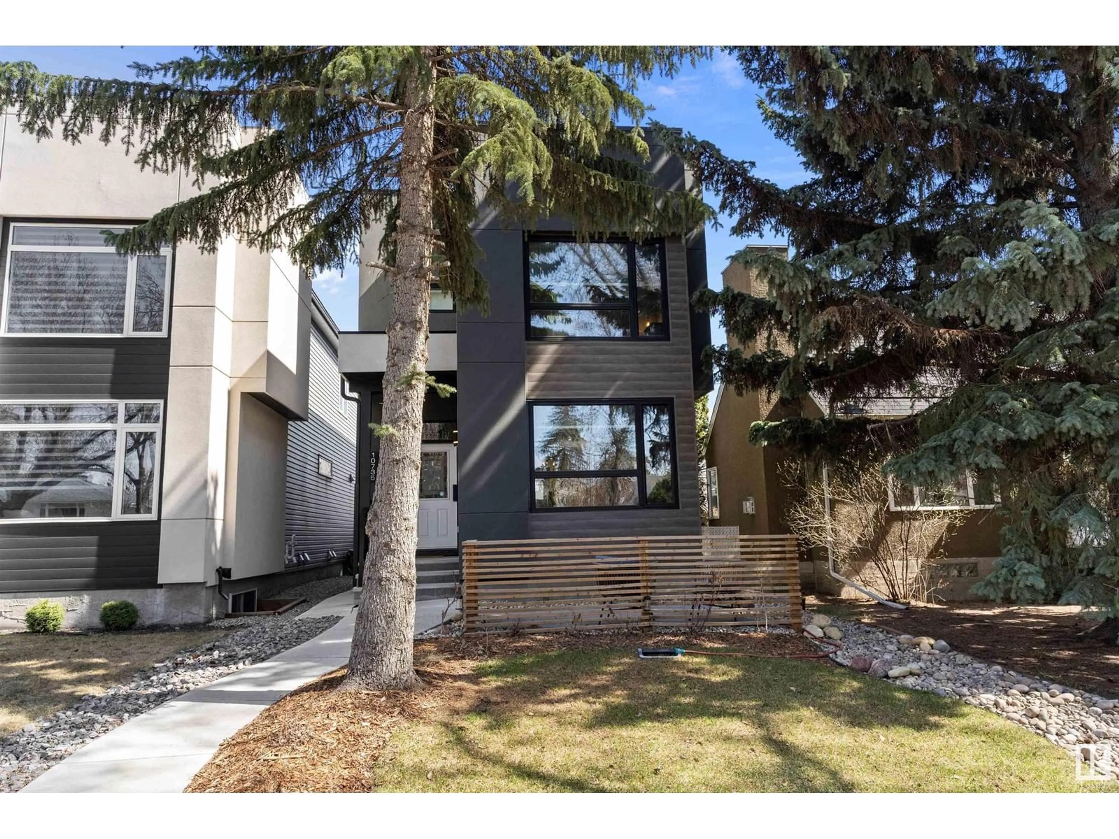 Home with vinyl exterior material, street for 10735 130 ST, Edmonton Alberta T5M0Z1