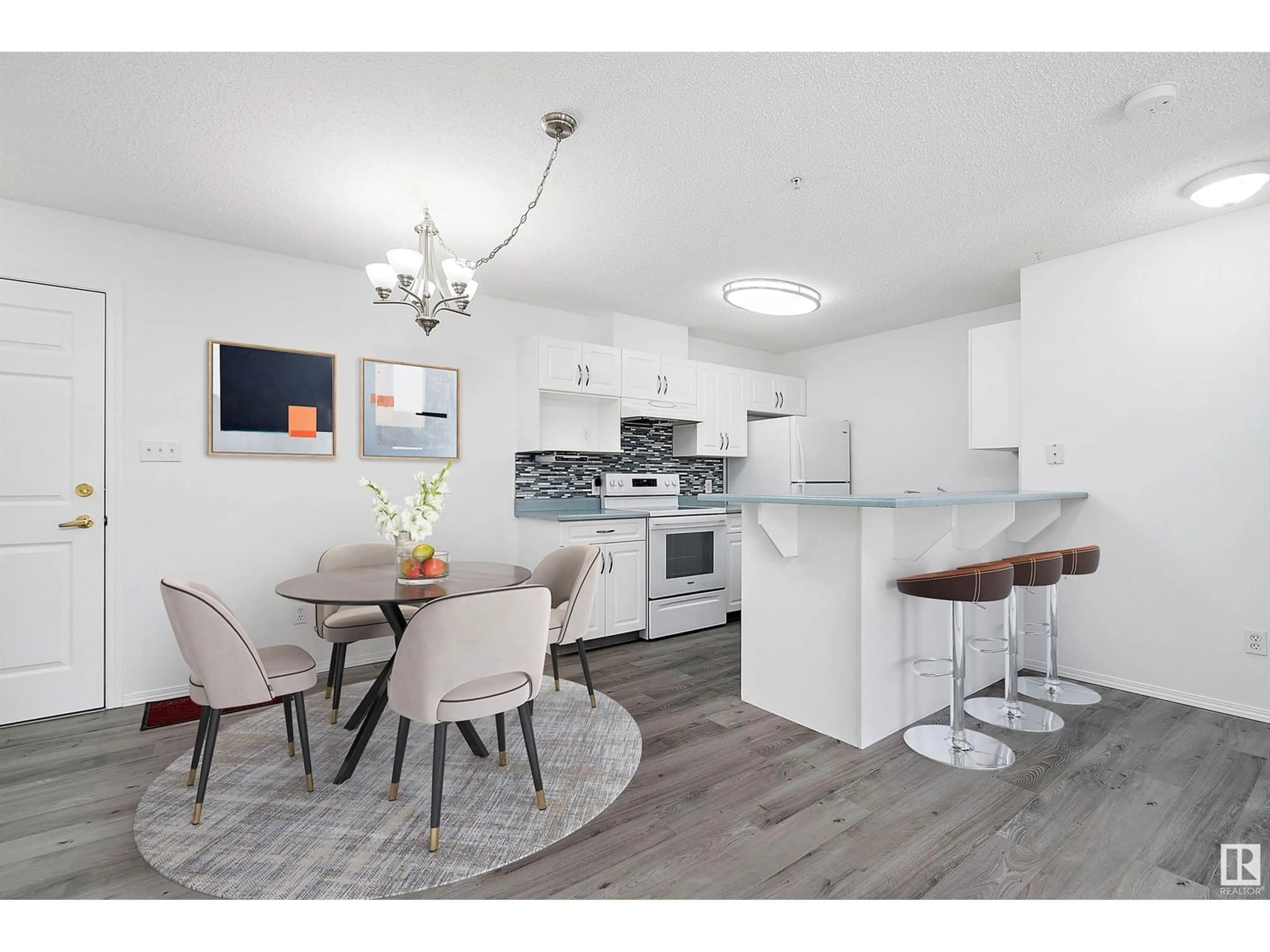 Open concept kitchen, wood/laminate floor for 301 - 5102 49 AV, Leduc Alberta T9E8H1