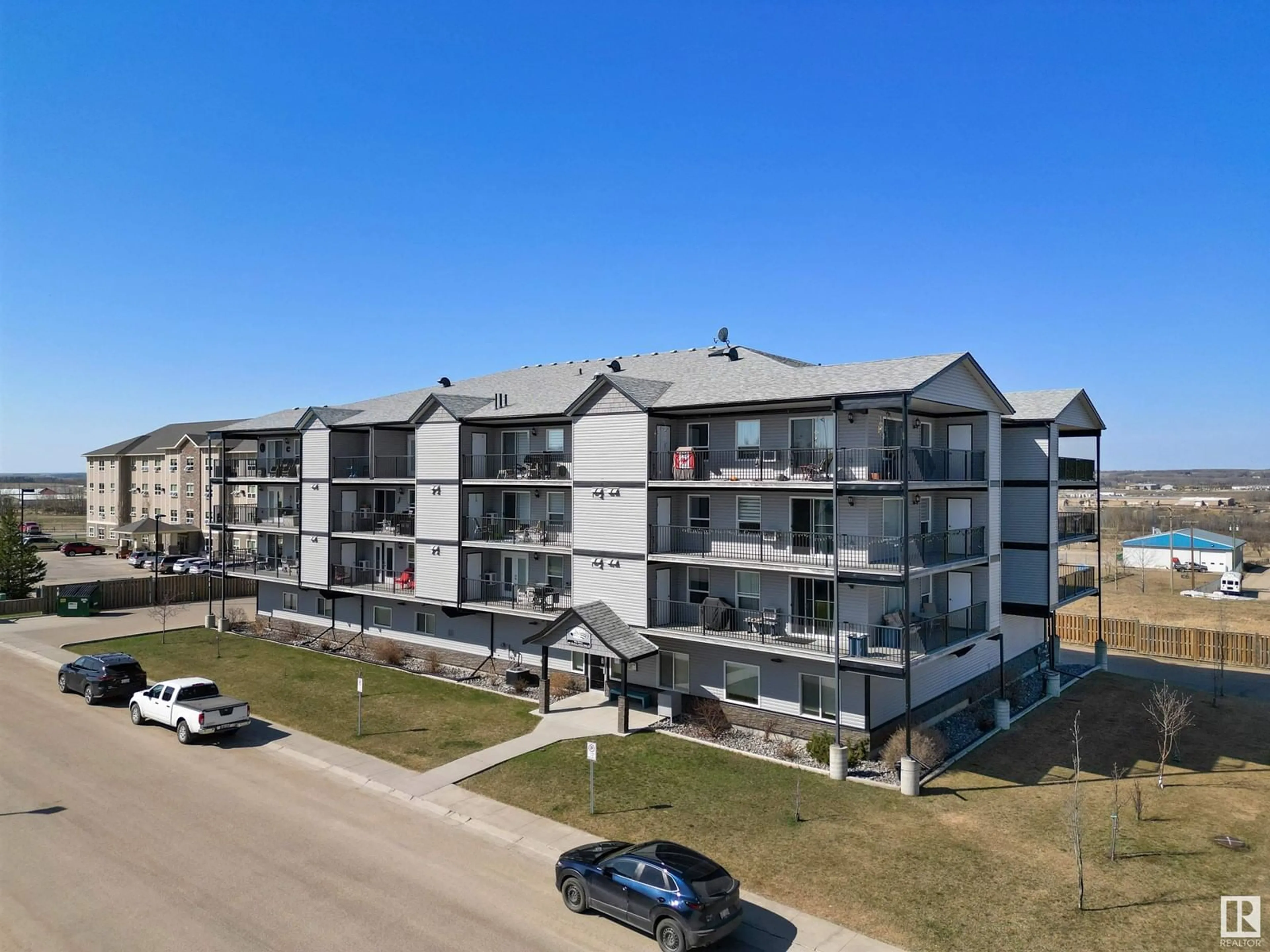 A pic from outside/outdoor area/front of a property/back of a property/a pic from drone, unknown for #202 - 4002 47 STREET, Drayton Valley Alberta T7A0A2