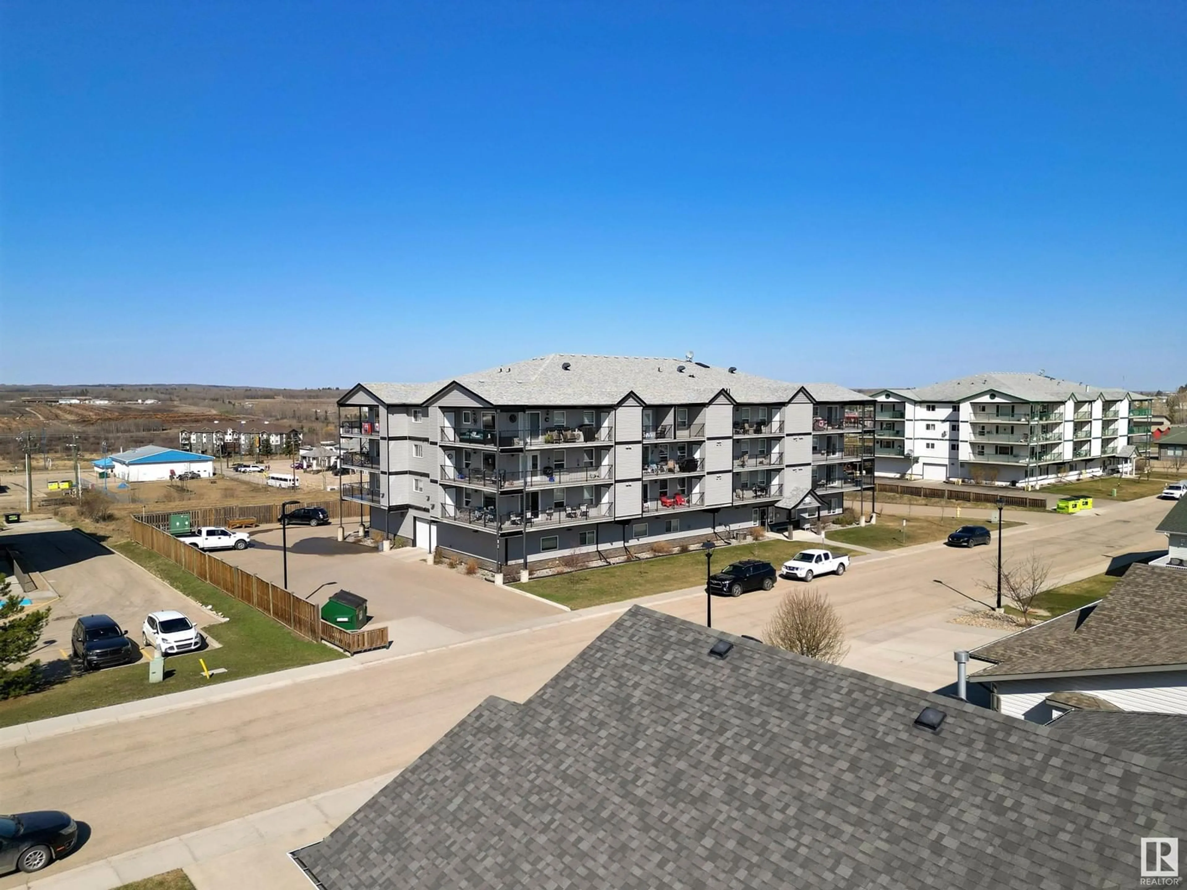 A pic from outside/outdoor area/front of a property/back of a property/a pic from drone, water/lake/river/ocean view for #202 - 4002 47 STREET, Drayton Valley Alberta T7A0A2