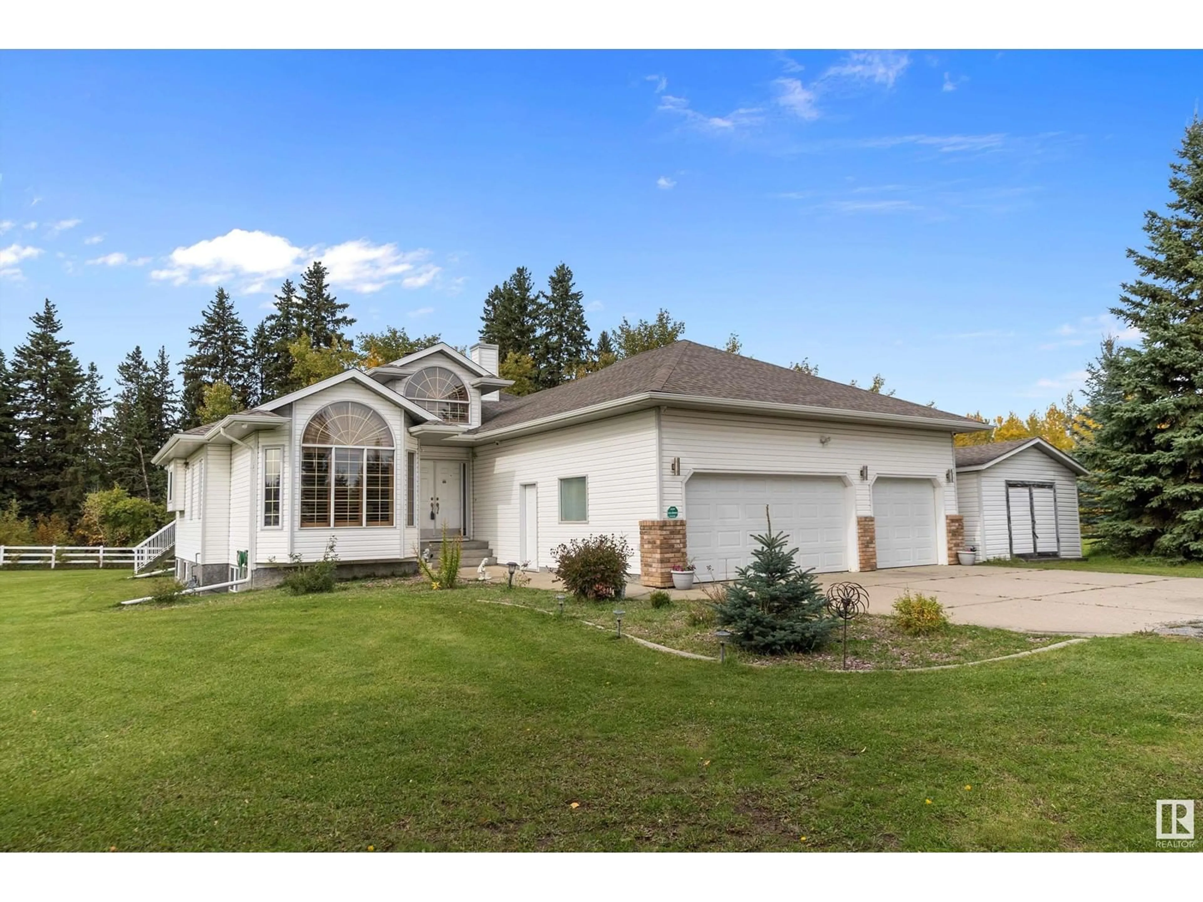 Home with vinyl exterior material, street for 474062 HIGHWAY 2A, Rural Wetaskiwin County Alberta T0C1Z0