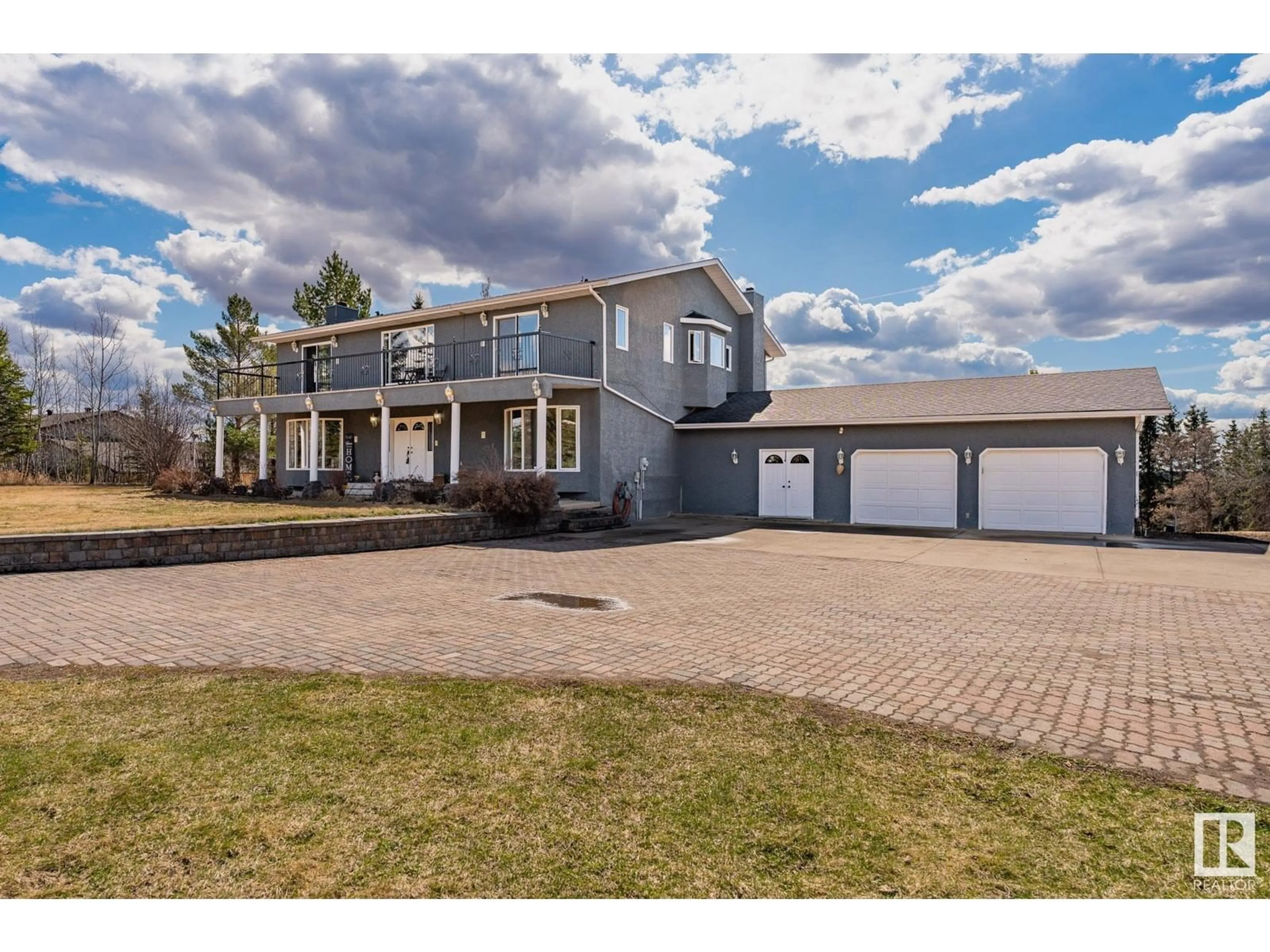 A pic from outside/outdoor area/front of a property/back of a property/a pic from drone, street for #218 - 21252 TWP ROAD 540, Rural Strathcona County Alberta T8G2A1