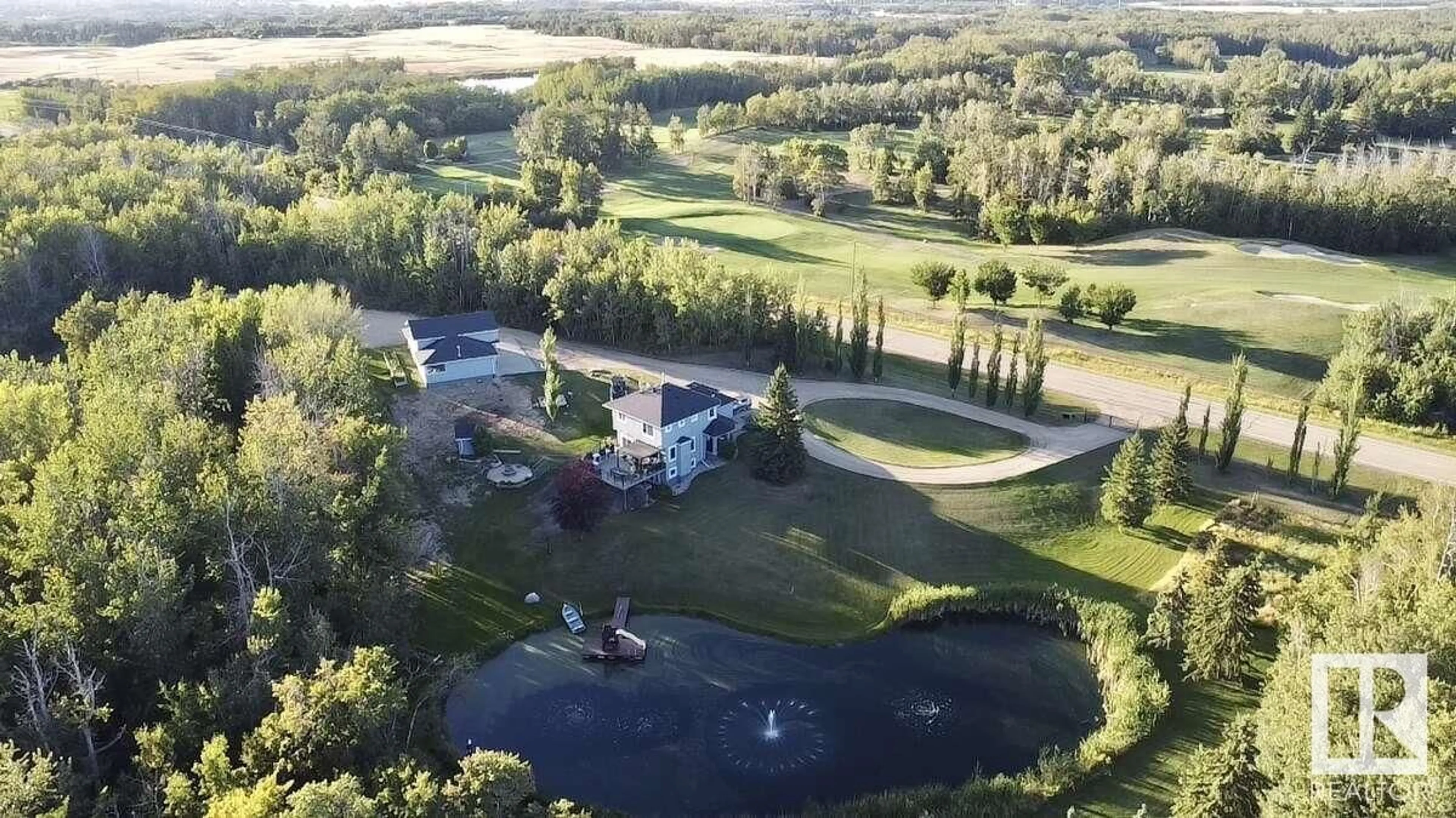 A pic from outside/outdoor area/front of a property/back of a property/a pic from drone, water/lake/river/ocean view for 23027 TOWNSHIP ROAD, Rural Strathcona County Alberta T8B1K9