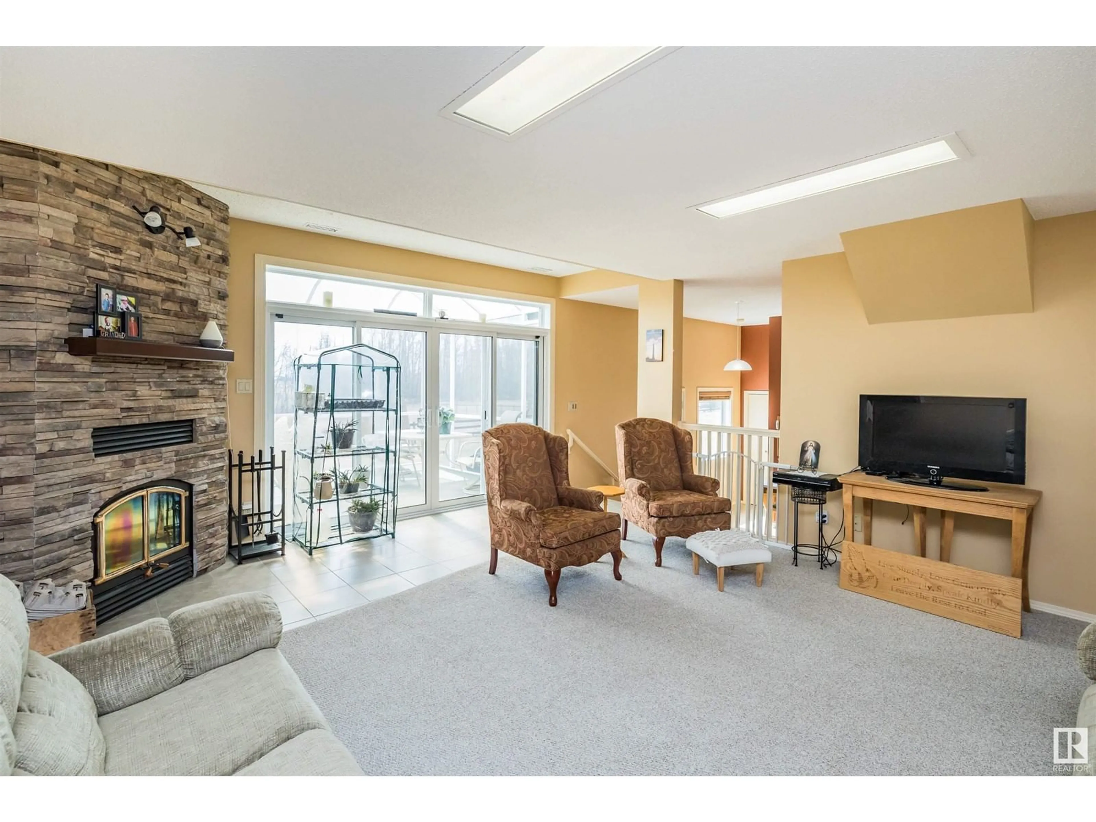 Living room with furniture, unknown for 25509 TWP RD 544, Rural Sturgeon County Alberta T8T1M7