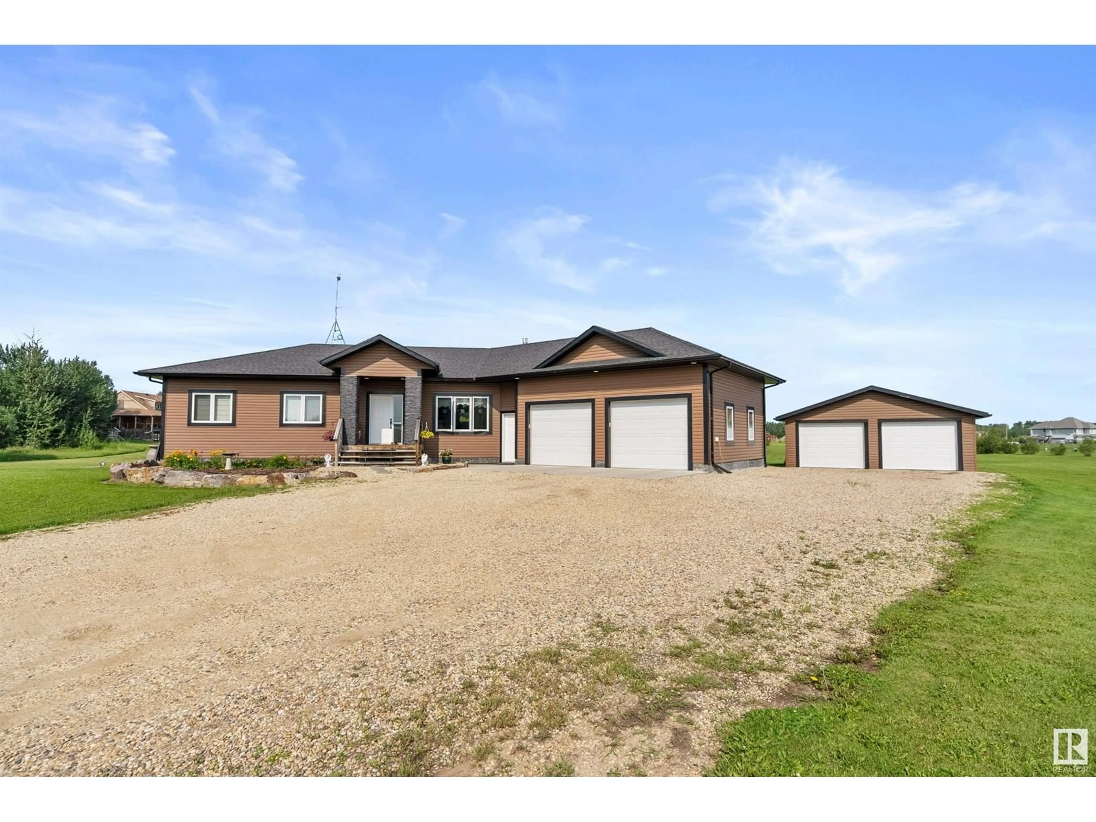 A pic from outside/outdoor area/front of a property/back of a property/a pic from drone, building for 310 21539 TWP 503, Rural Leduc County Alberta T0B3M2
