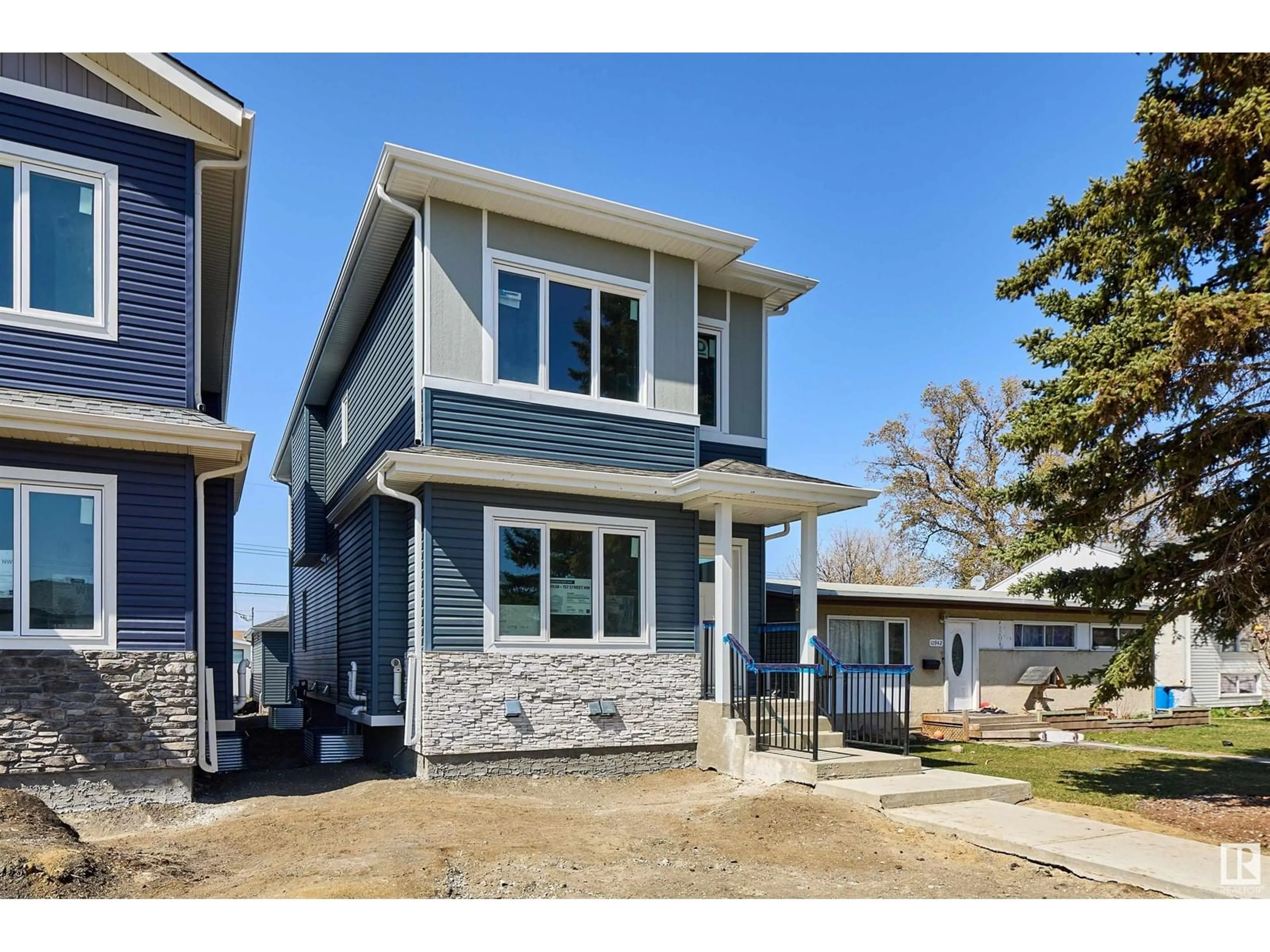 Home with vinyl exterior material, street for 10938 157 ST, Edmonton Alberta T5P4Y2