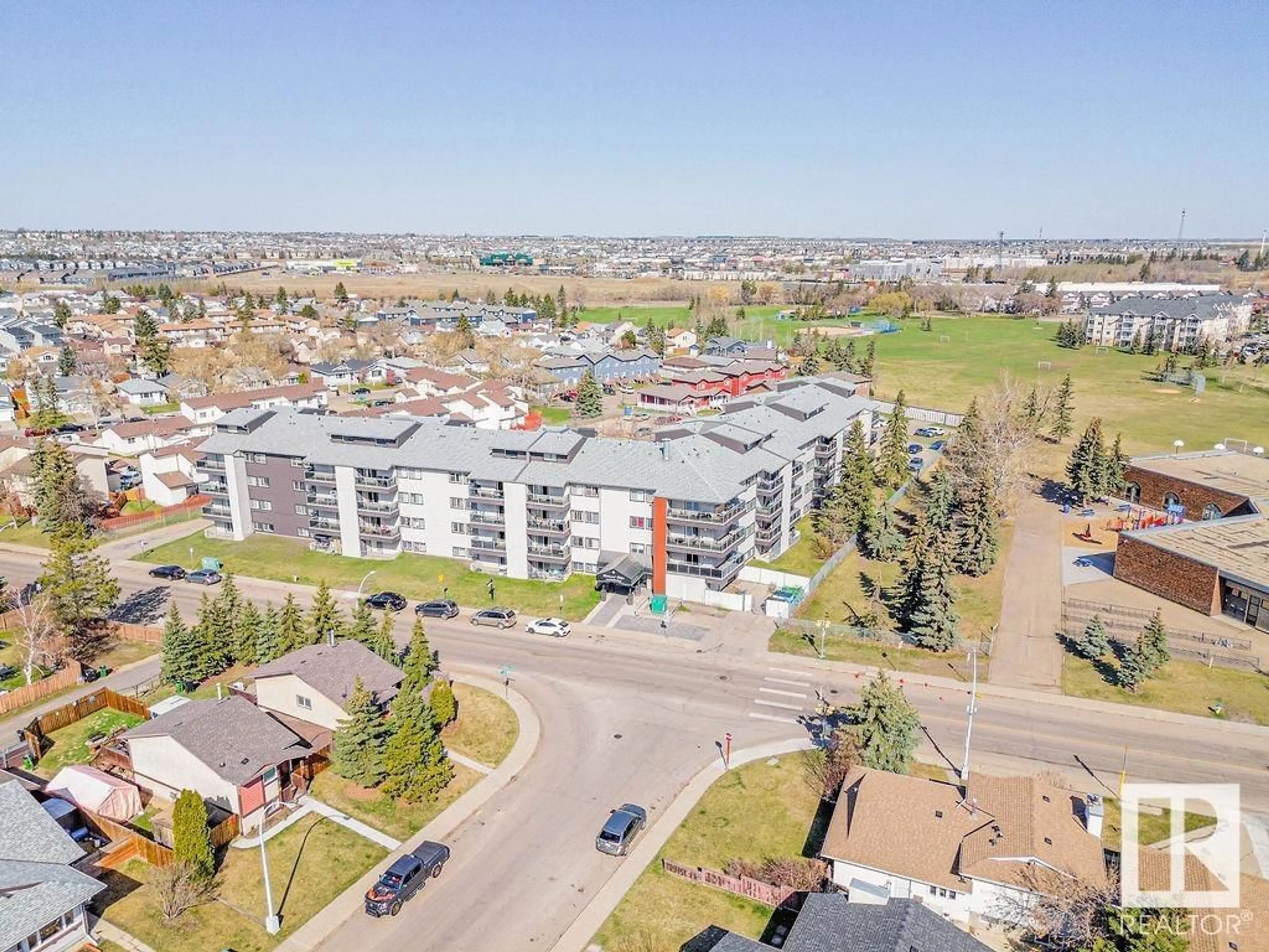 A pic from outside/outdoor area/front of a property/back of a property/a pic from drone, unknown for 306 - 600 KIRKNESS RD, Edmonton Alberta T5Y2H5