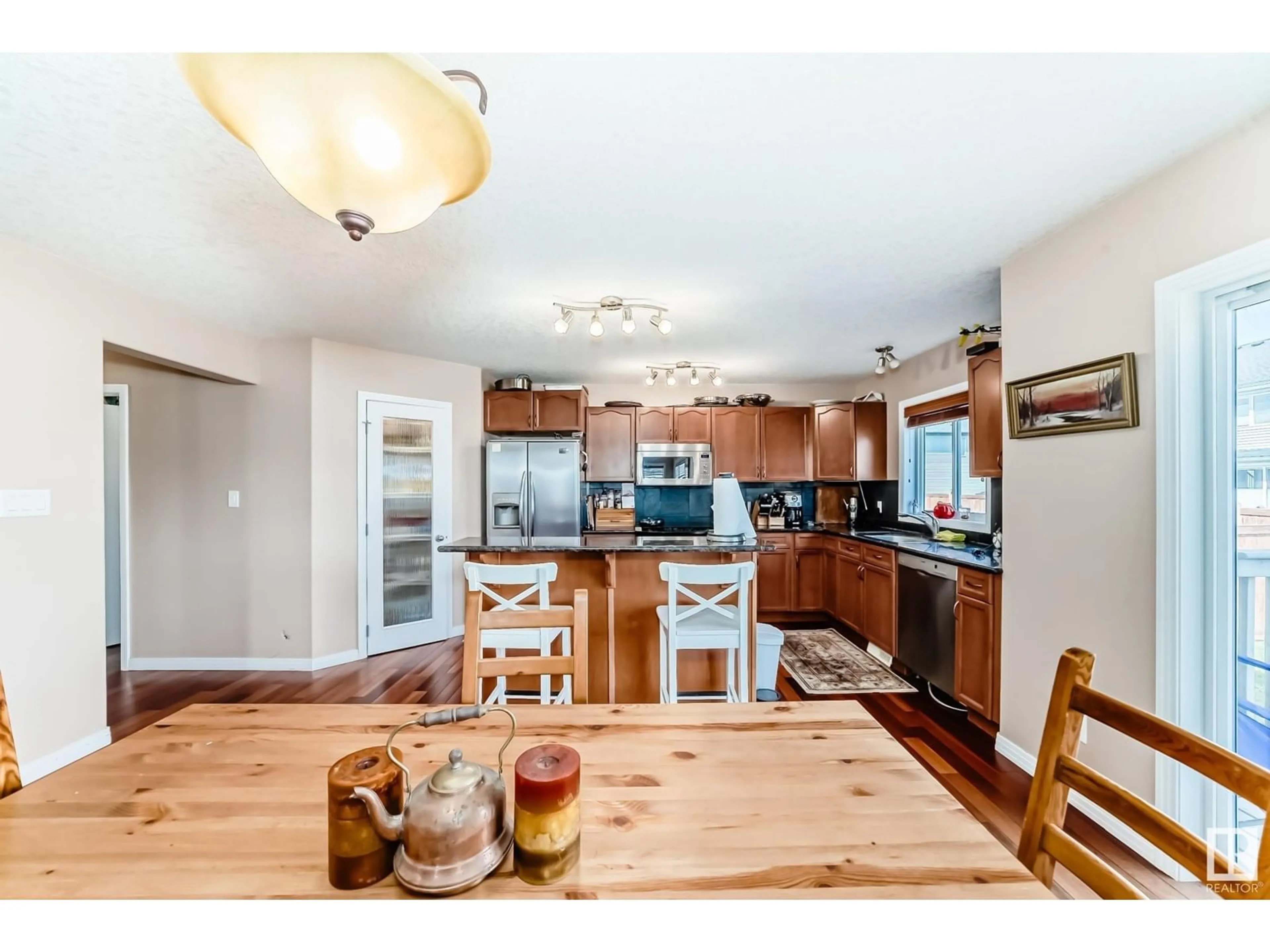 Open concept kitchen, wood/laminate floor for 123 SHORES DR, Leduc Alberta T9E0K9