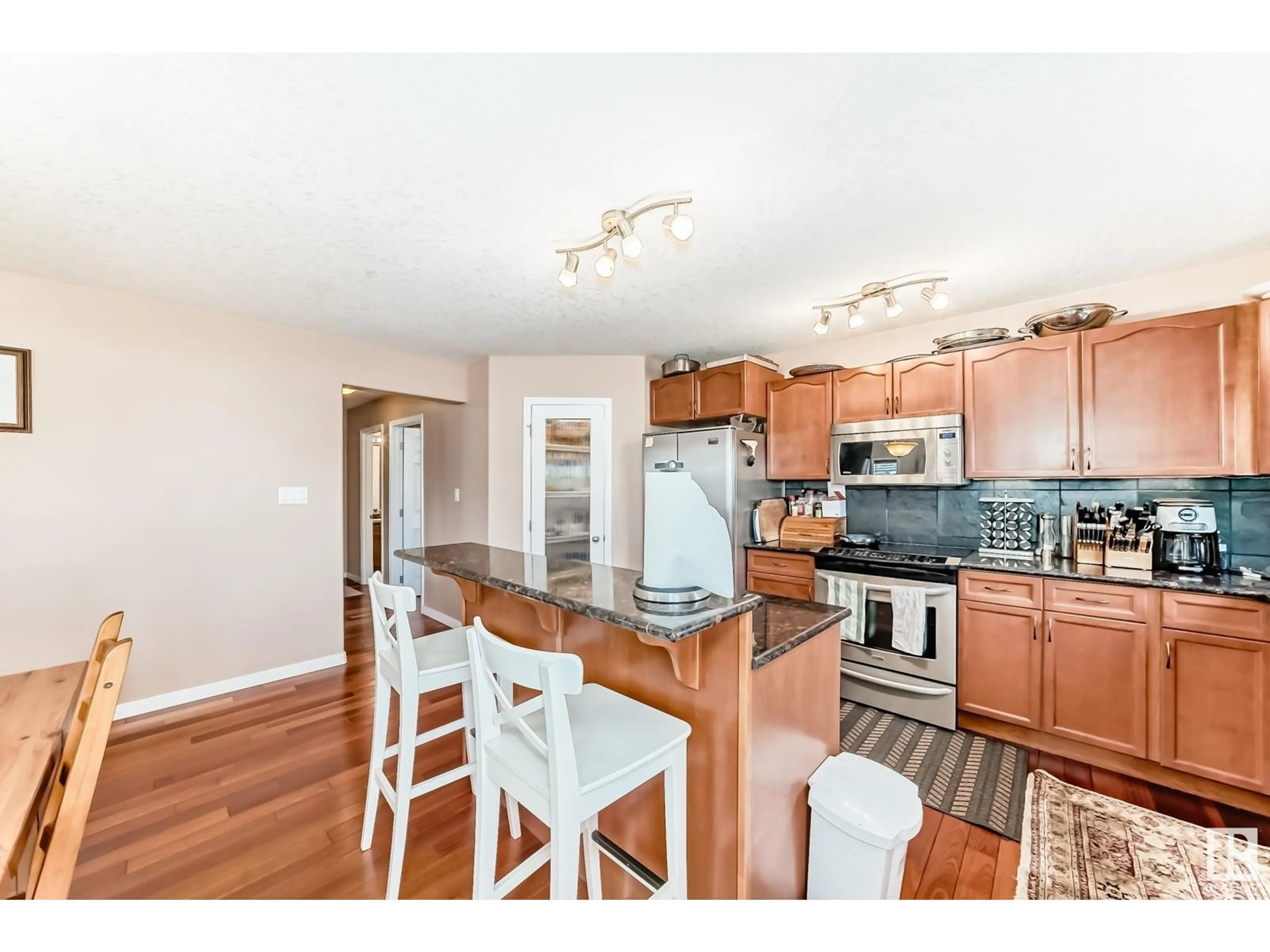 Open concept kitchen, wood/laminate floor for 123 SHORES DR, Leduc Alberta T9E0K9