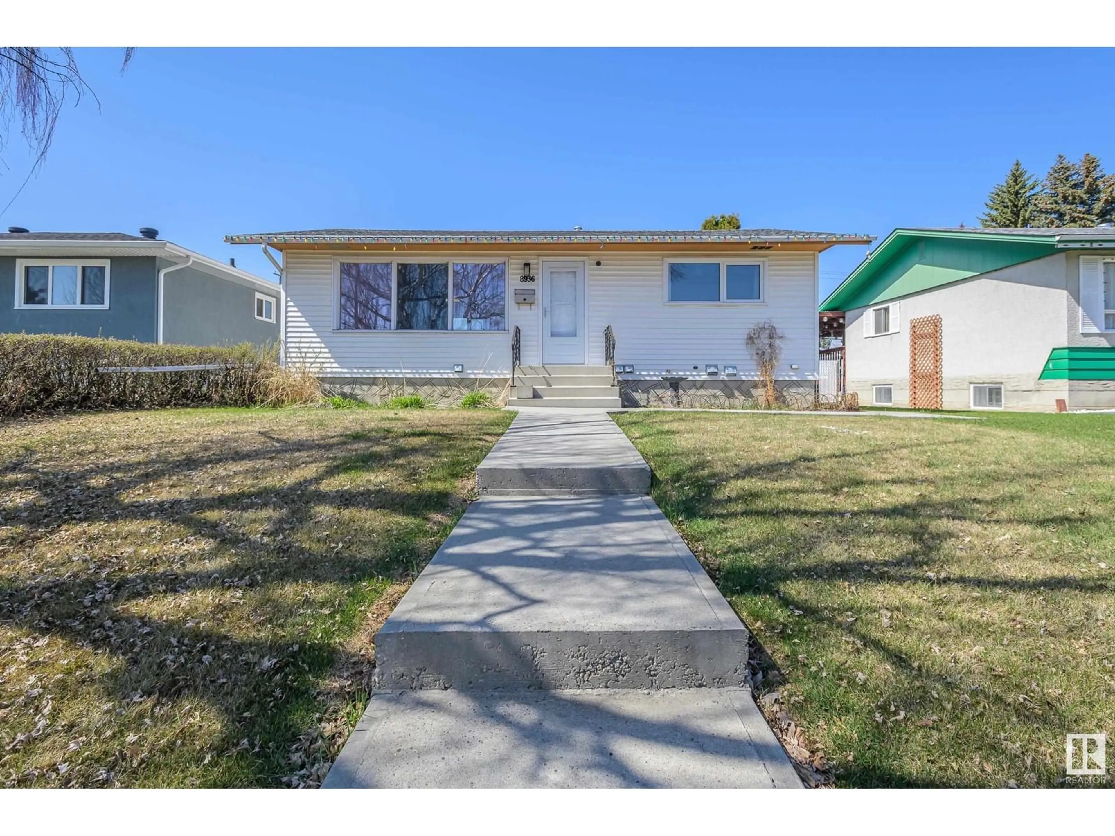 Home with vinyl exterior material, street for 8936 153 ST, Edmonton Alberta T6E0S9